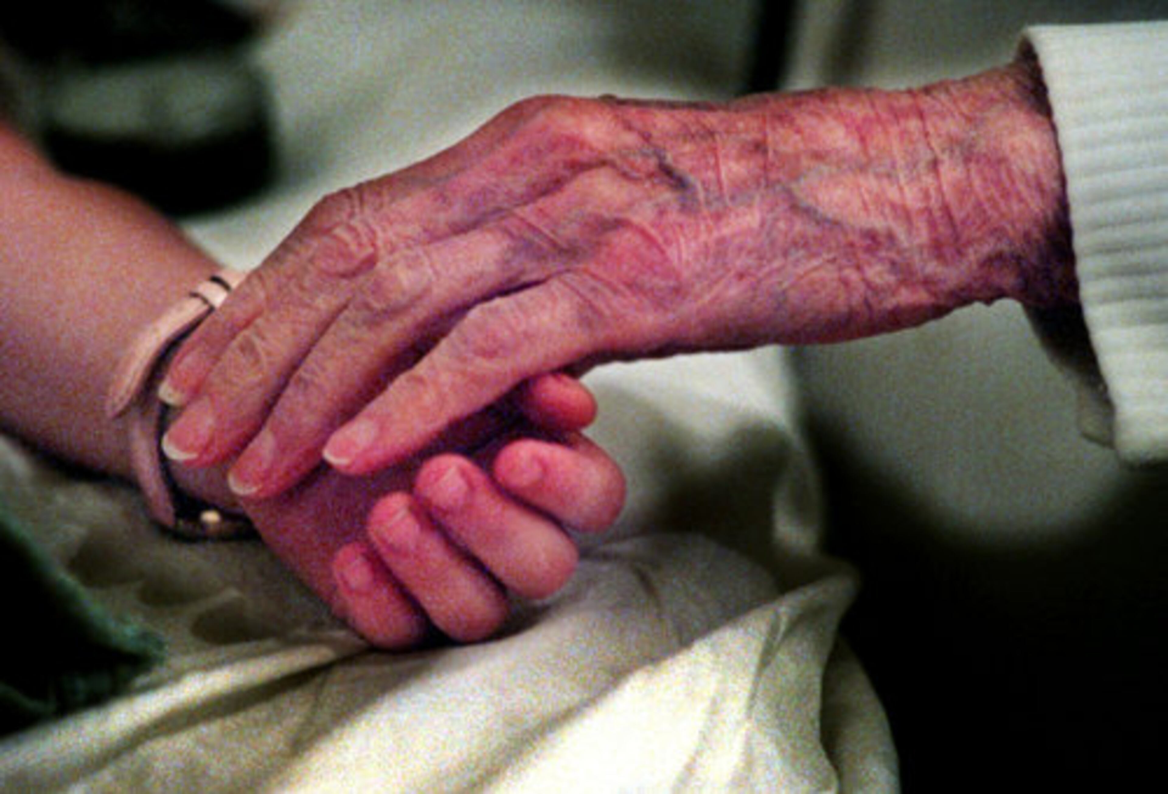Denmark touches the hand of 4-year-old Jamey Braswell during an office in 1998 for a sore throat at her 125-year-old farmhouse next door to her home. Denmark began treating sick children in her home the same year Mickey Mouse made his debut. By the time she retired, she was treating the grandchildren of some of her early patients -- and still in a home office.