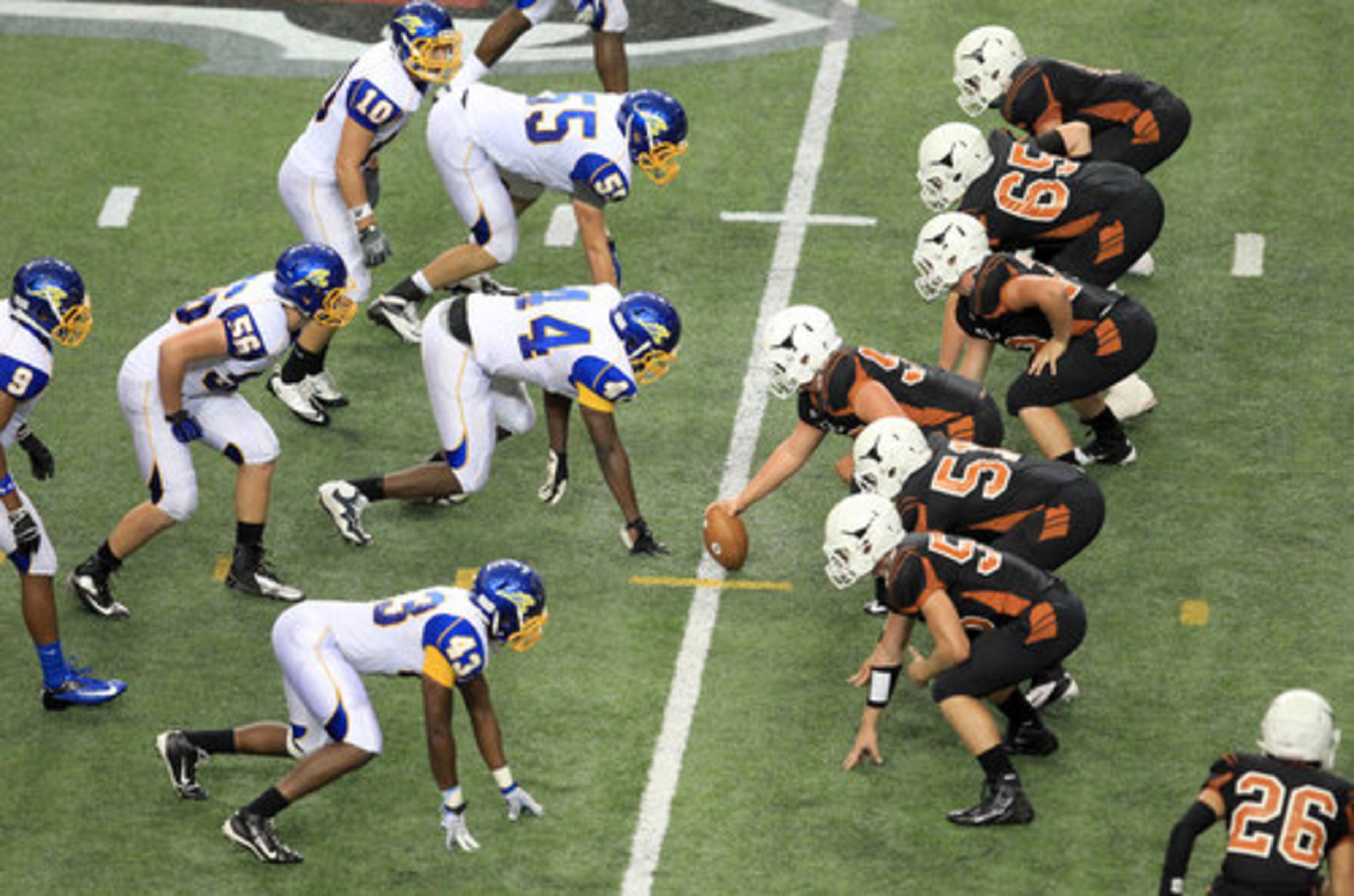 Kell center Nathan Waller (50) prepares to snap the ball for the Kell offense in their game against Chattahoochee in the first game of the Corky Kell Classic at the Georgia Dome Saturday morning.