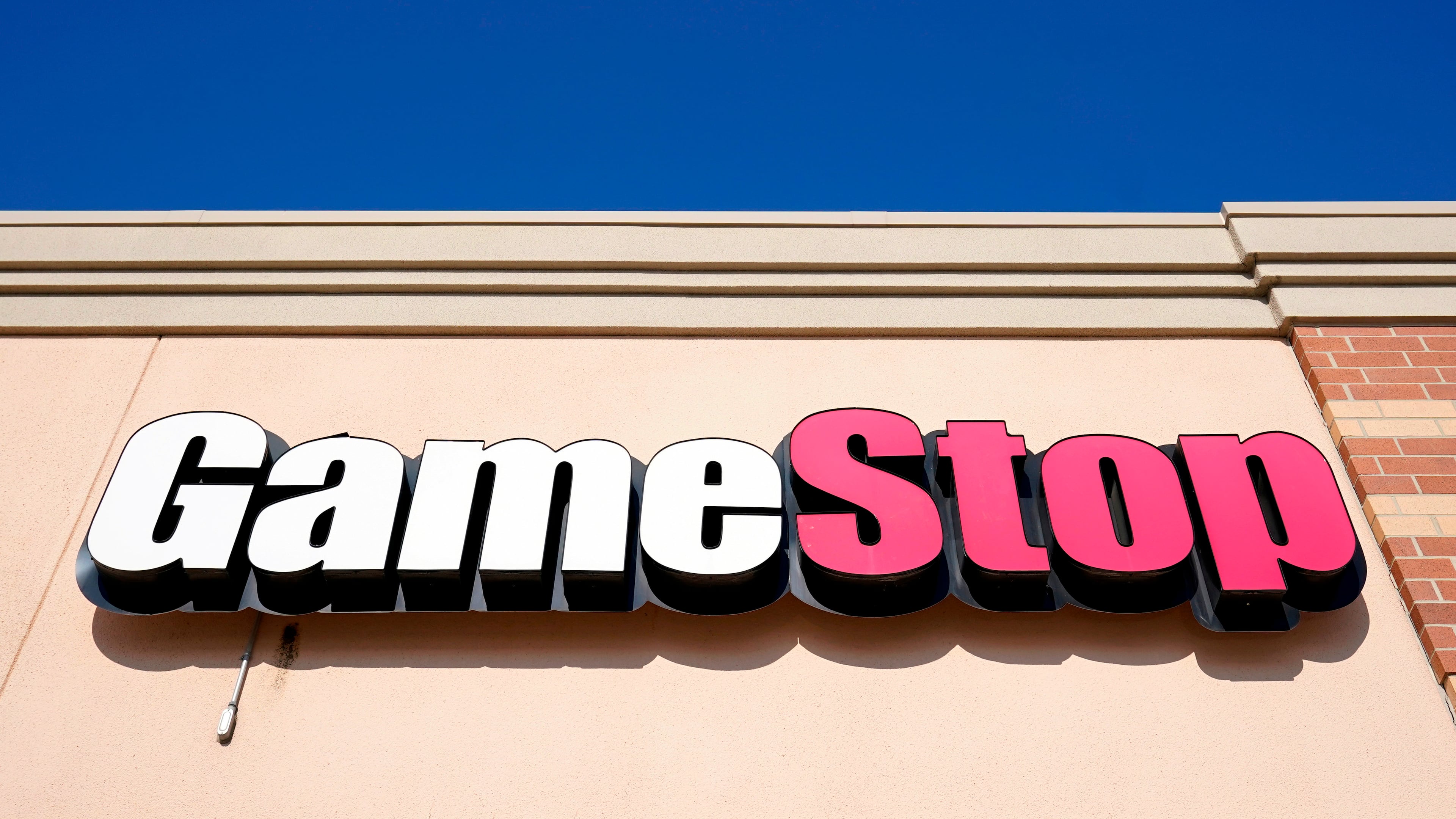 FILE - A GameStop sign is displayed above a store in Urbandale, Iowa, on Jan. 28, 2021. (AP Photo/Charlie Neibergall, File)