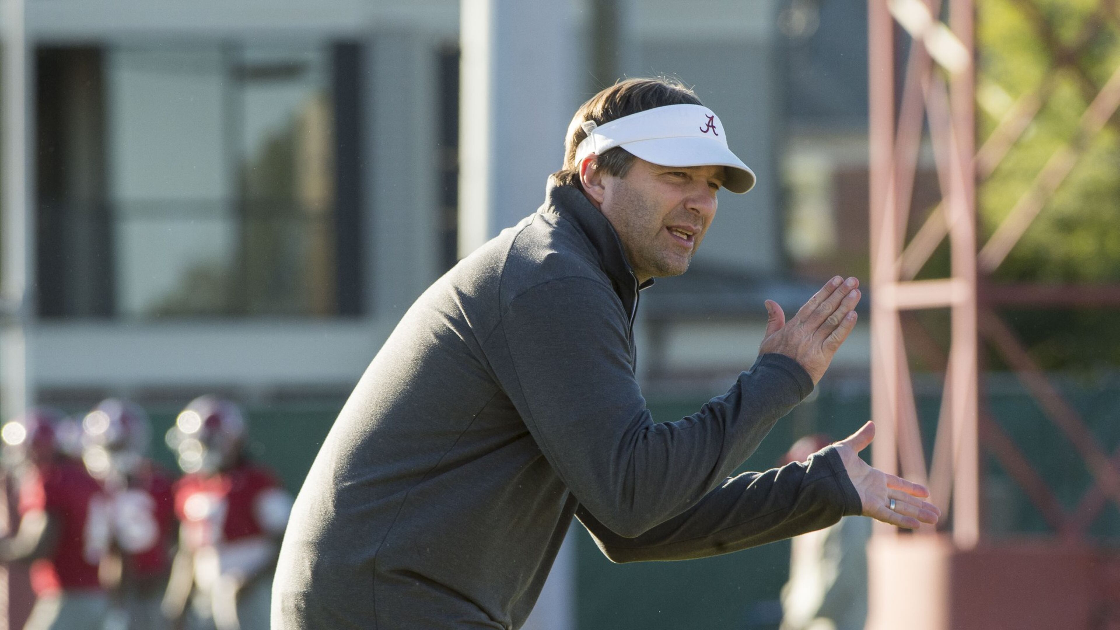 Alabama defensive coordinator/inside linebackers coach Kirby Smart works with his linebackers during an NCAA college football practice in October in Tuscaloosa, Ala. (Vasha Hunt/AL.com via AP)