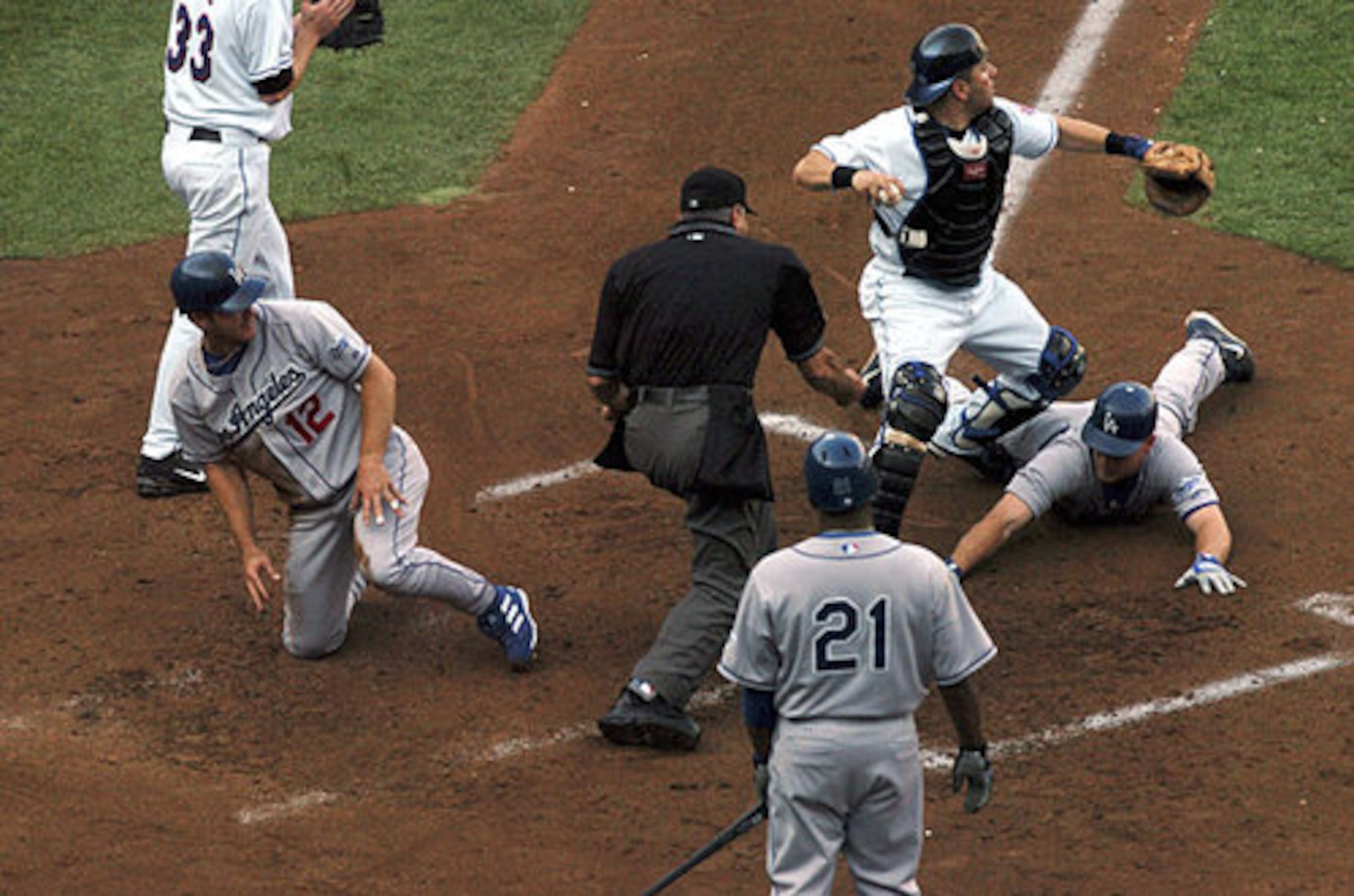 In the 2006 National League Division Series, the Dodgers had two players -- J.D. Drew (right) and Jeff Kent-- thrown out at home plate within seconds of each other.