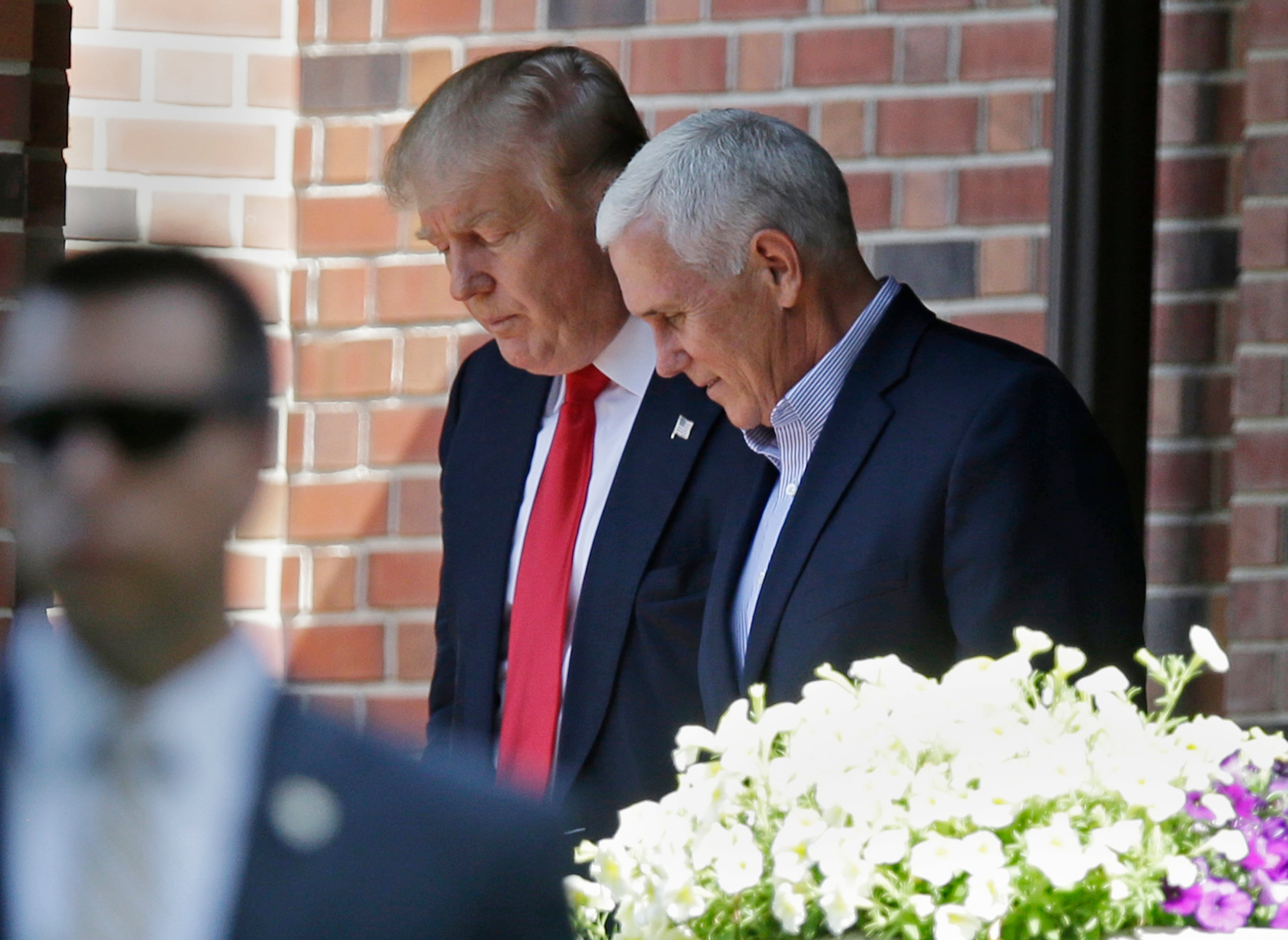 Republican presidential candidate Donald Trump leaves the Indiana Governor's residence with Gov. Mike Pence in Indianapolis, Wednesday, July 13, 2016. (AP Photo/Michael Conroy)