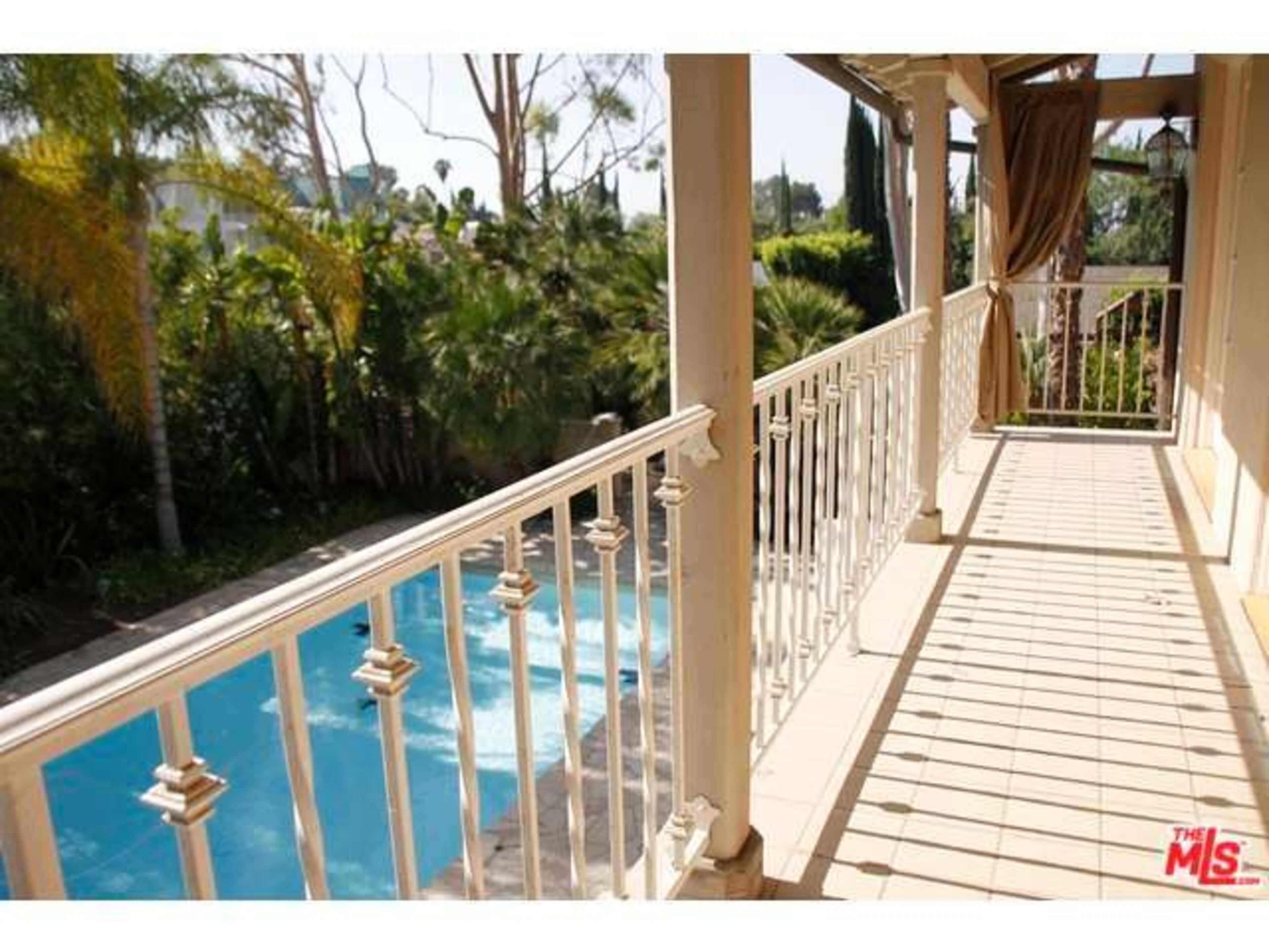 The property features a cabana, guest house and offers tree-top views. Information: http://www.redfin.com/CA/Tarzana/5143-Otis-Ave-91356/home/4110687