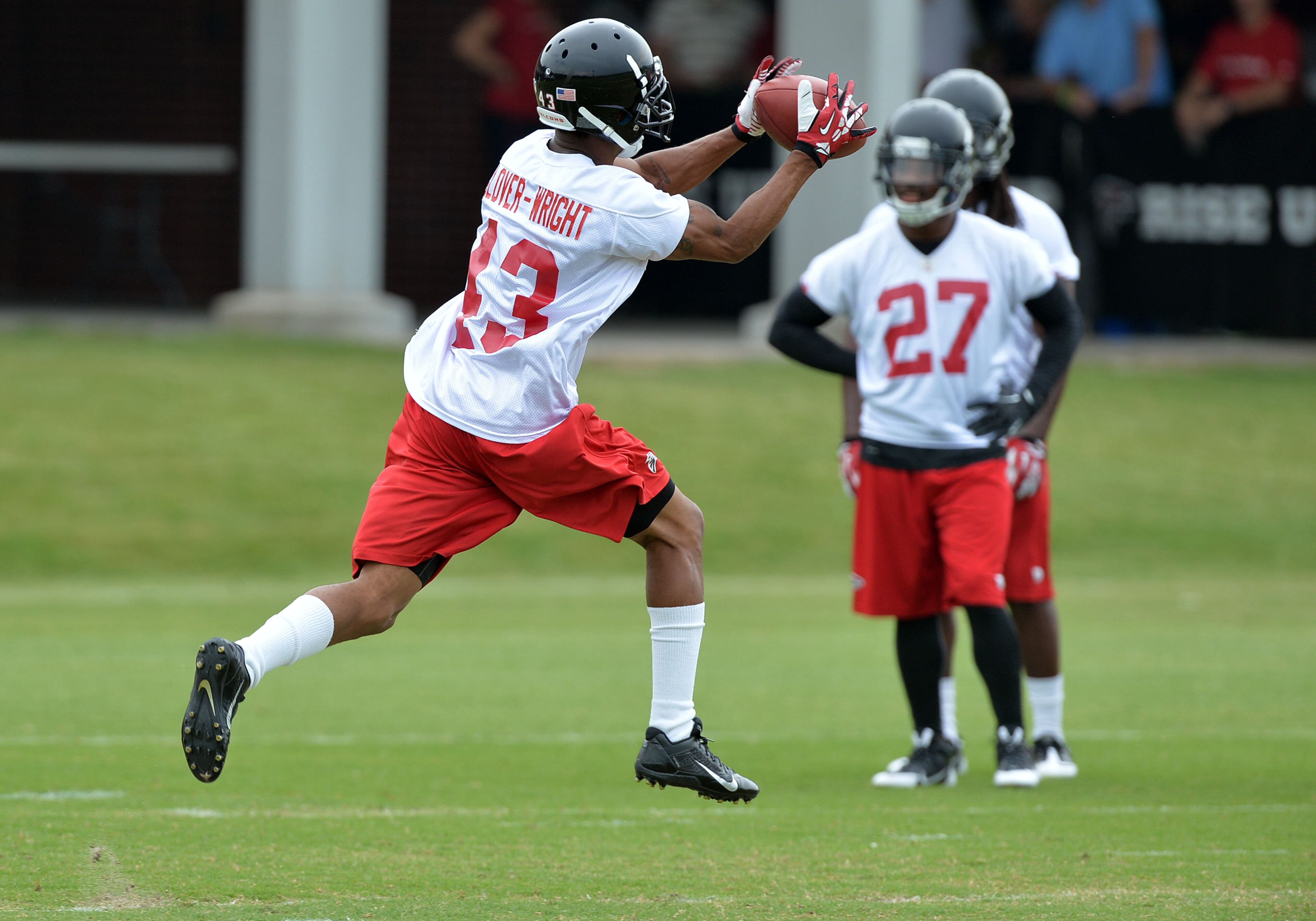 Falcons cornerback Devonta Glover-Wright (43)catches a throw during the mini-camp. Atlanta Falcons players workout during the second day of mini-camp at the team's facilities in Flowery Branch, Wednesday, June 18, 2014. KENT D. JOHNSON/KDJOHNSON@AJC.COM