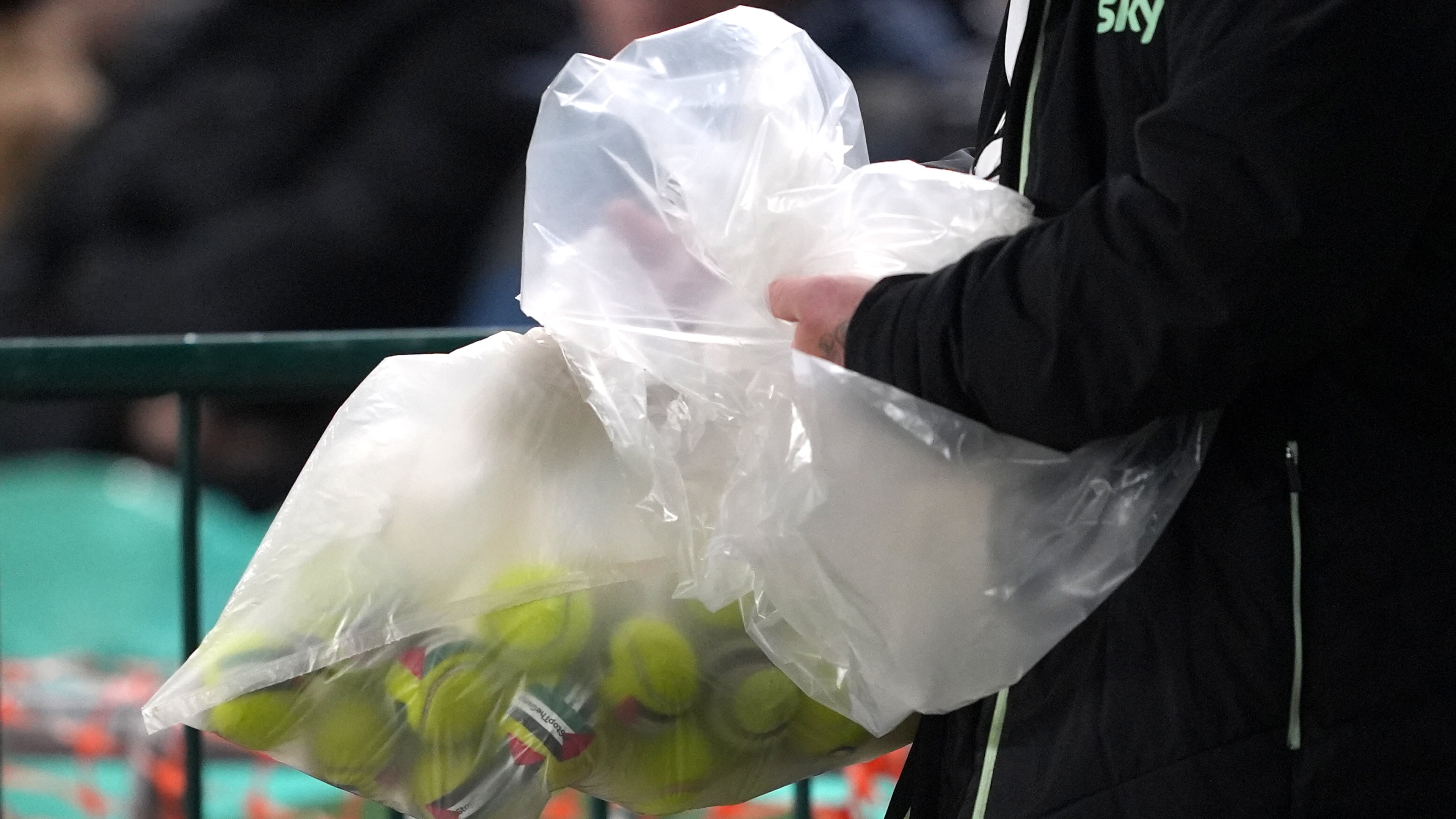 Tennis balls with stickers of the Palestine flag and the text, "#StopTheGame," are removed from the field after being thrown by protesters during the UEFA Nations League, Group B3 match at the Aviva Stadium in Dublin on Thursday, Oct. 1, 2026. (Brian Lawless/PA via AP)
