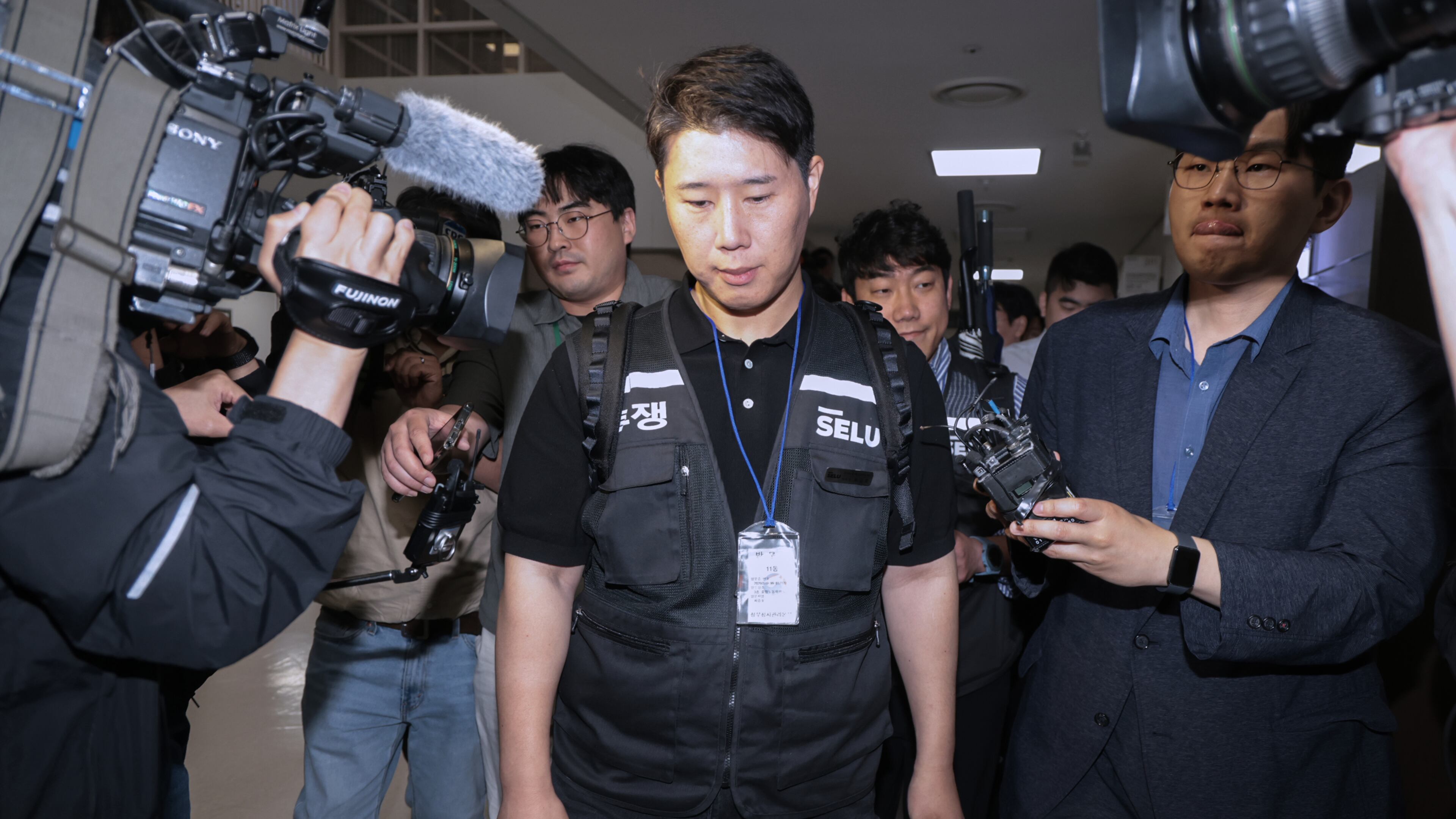 Choi Seung-ho, a leader of the Samsung Electronics labor union, leaves after attending the government-led mediation talks with management at the National Labor Relations Commission office in Sejong, South Korea, Wednesday, May 20, 2026 (Yonhap via AP)