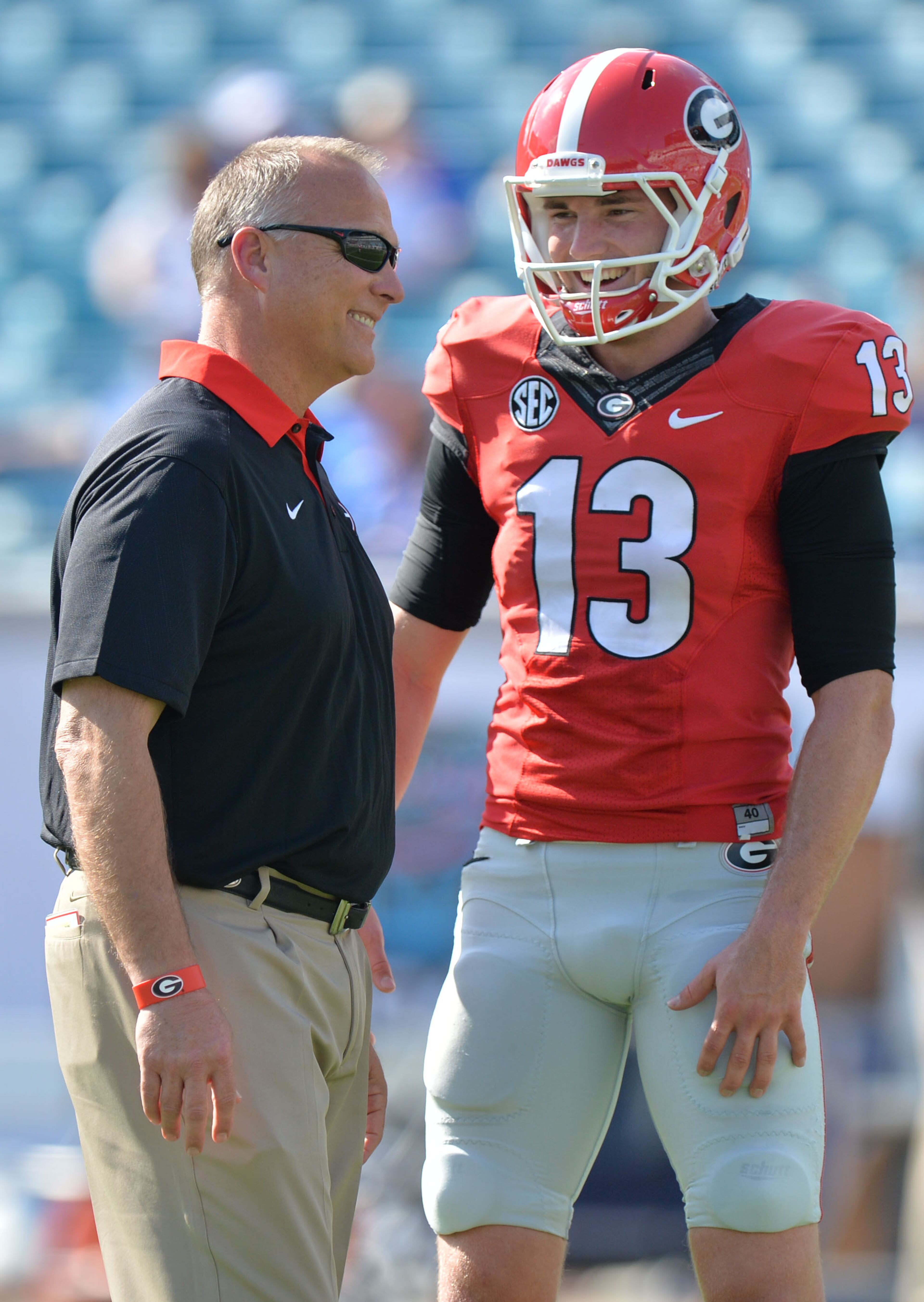 October 31, 2015 Jacksonville, Florida - Georgia Bulldogs head coach Mark Richt shares a laugh with Georgia Bulldogs place kicker Marshall Morgan (13) before their game against the Florida Gators at EverBank Field in Jacksonville, Florida on Saturday, October 31, 2015. HYOSUB SHIN / HSHIN@AJC.COM