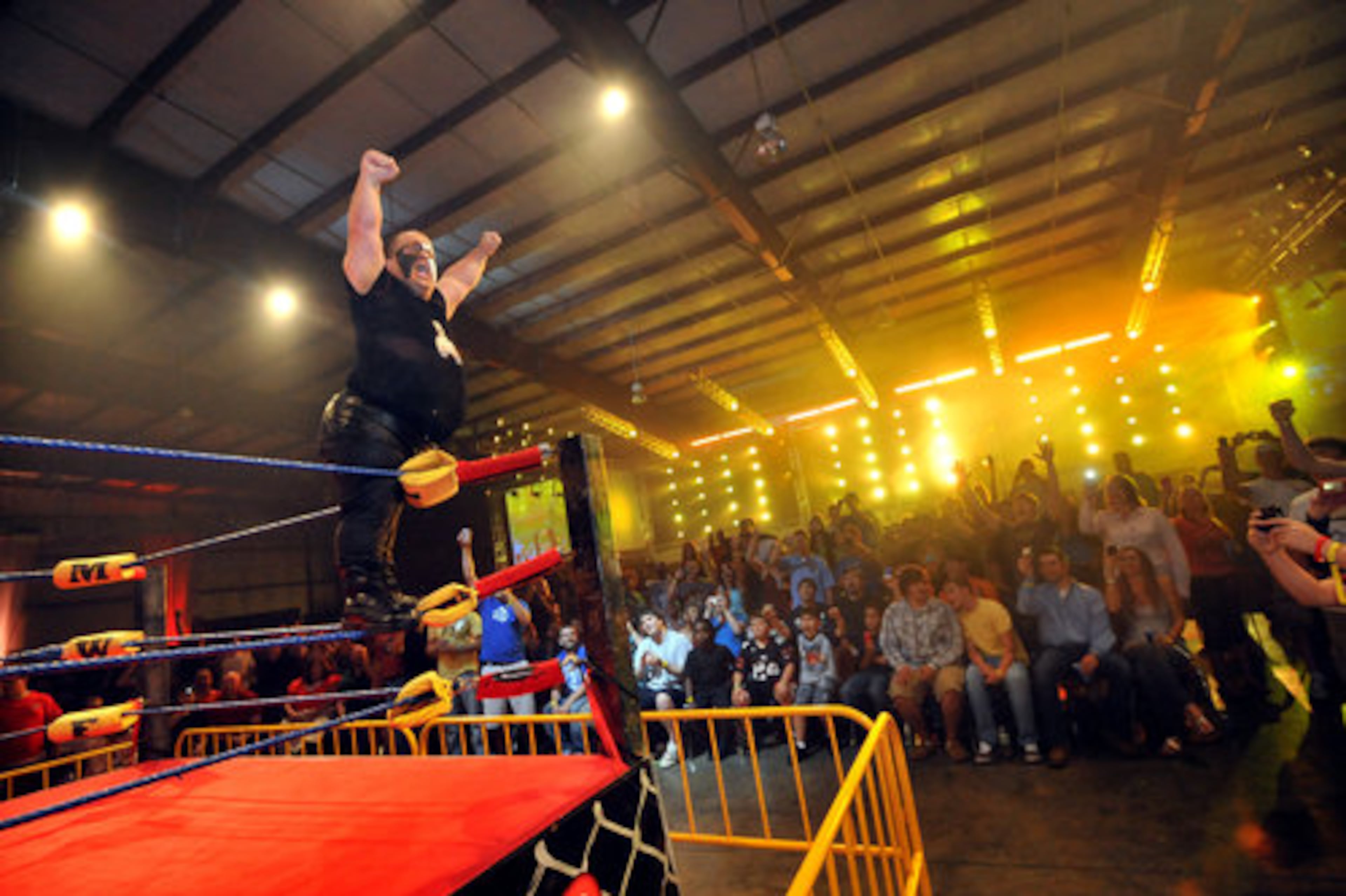 "Beast" Tim Arnett greets fans as he enters the ring.