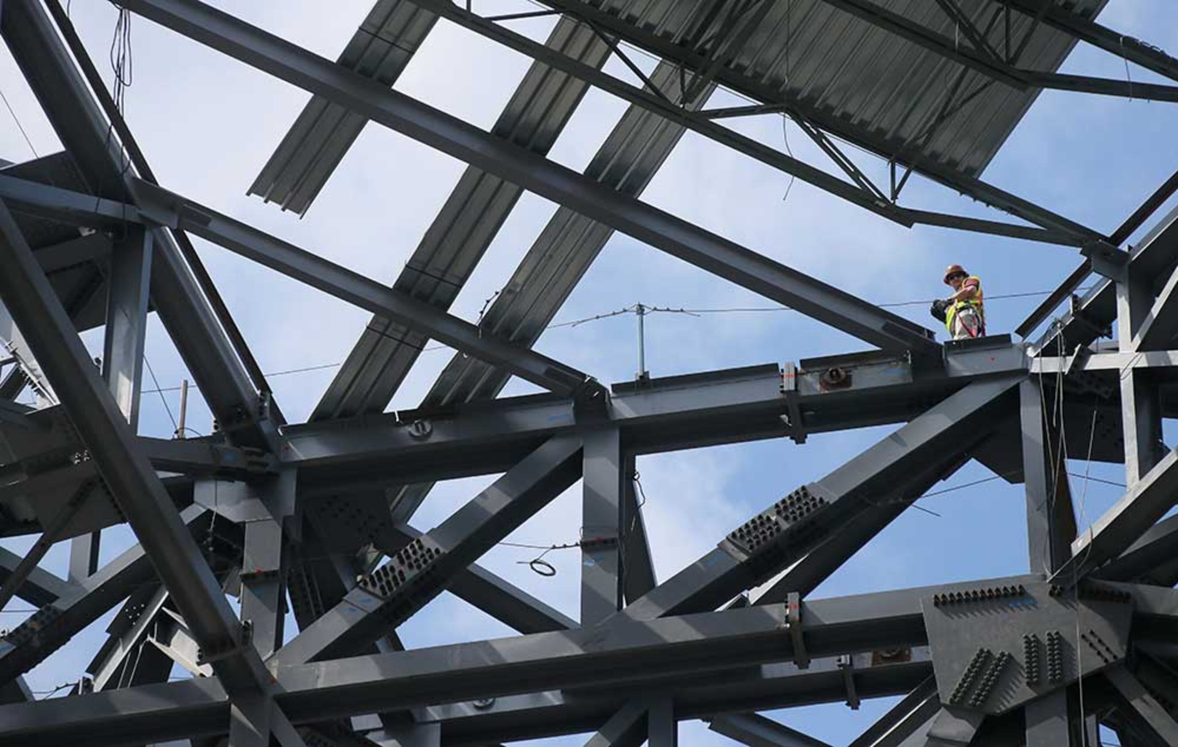 Tower and roof steel truss construction as viewed from field level in the bowl.