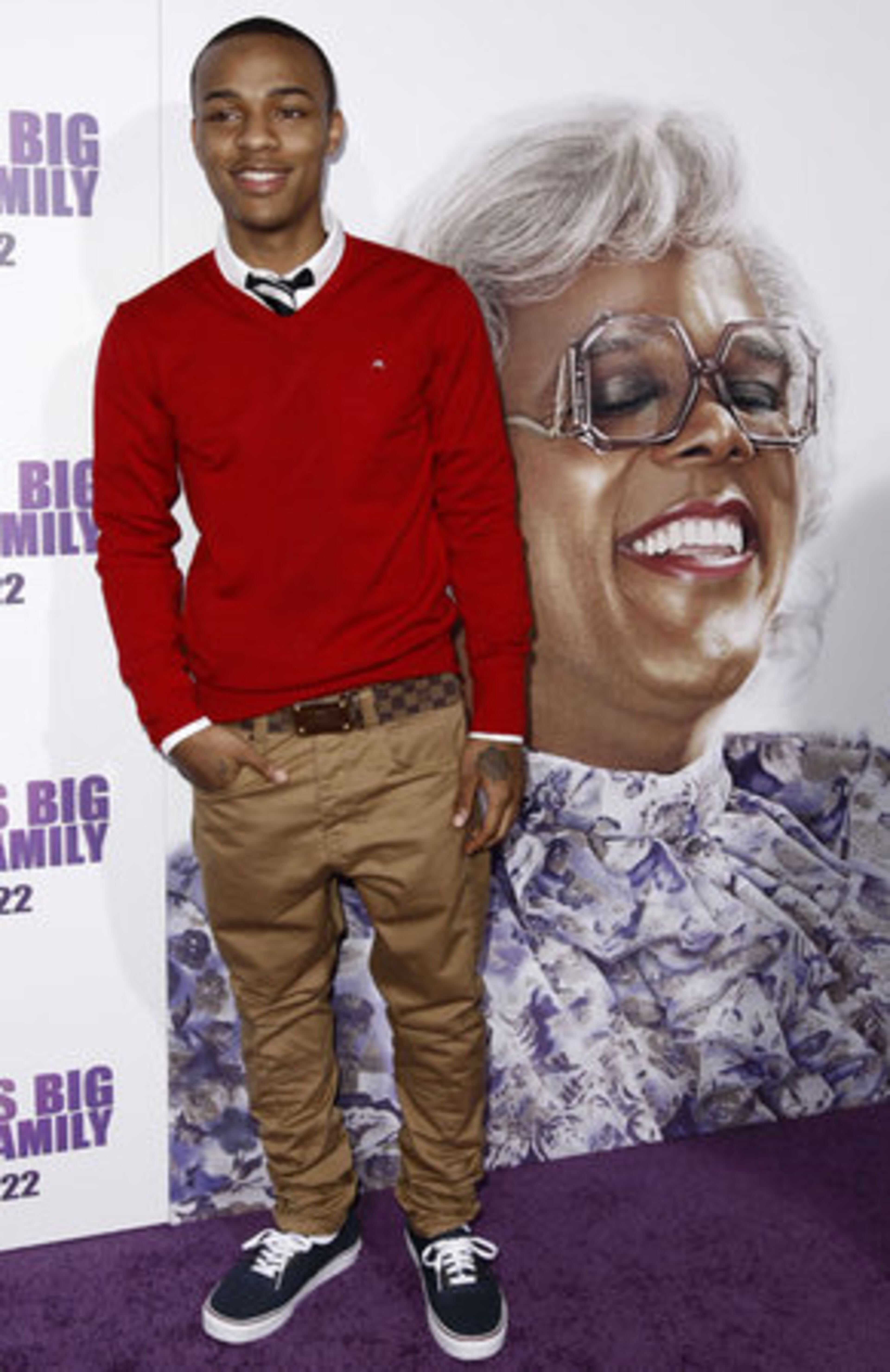Cast member Shad "Bow Wow" Moss poses for a photo on the purple carpet.