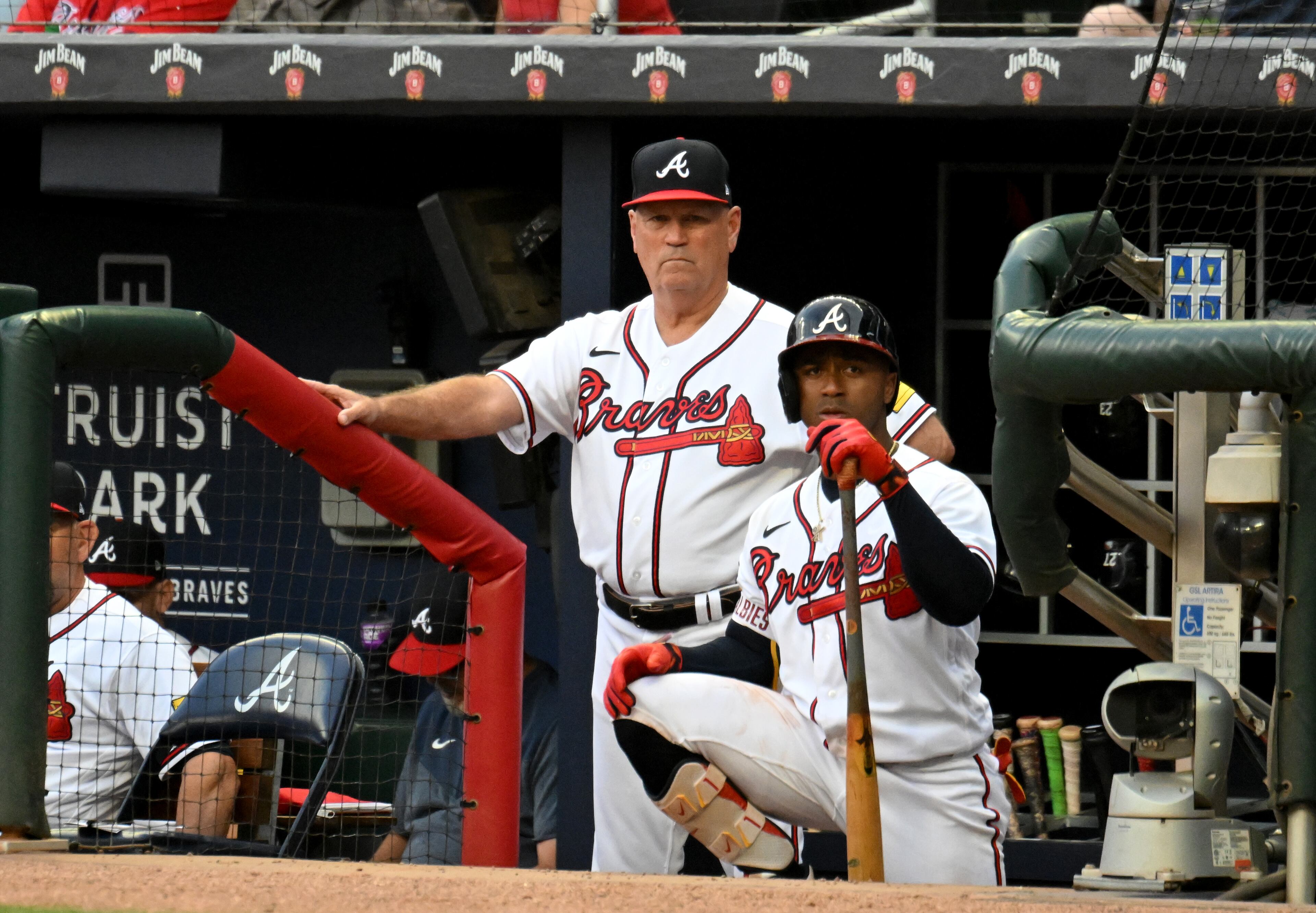 Atlanta Braves’ manager Brian Snitker and second baseman Ozzie Albies (1) watch during the second inning at Truist Park, Wednesday, May 24, 2023, in Atlanta. (Hyosub Shin / Hyosub.Shin@ajc.com)
