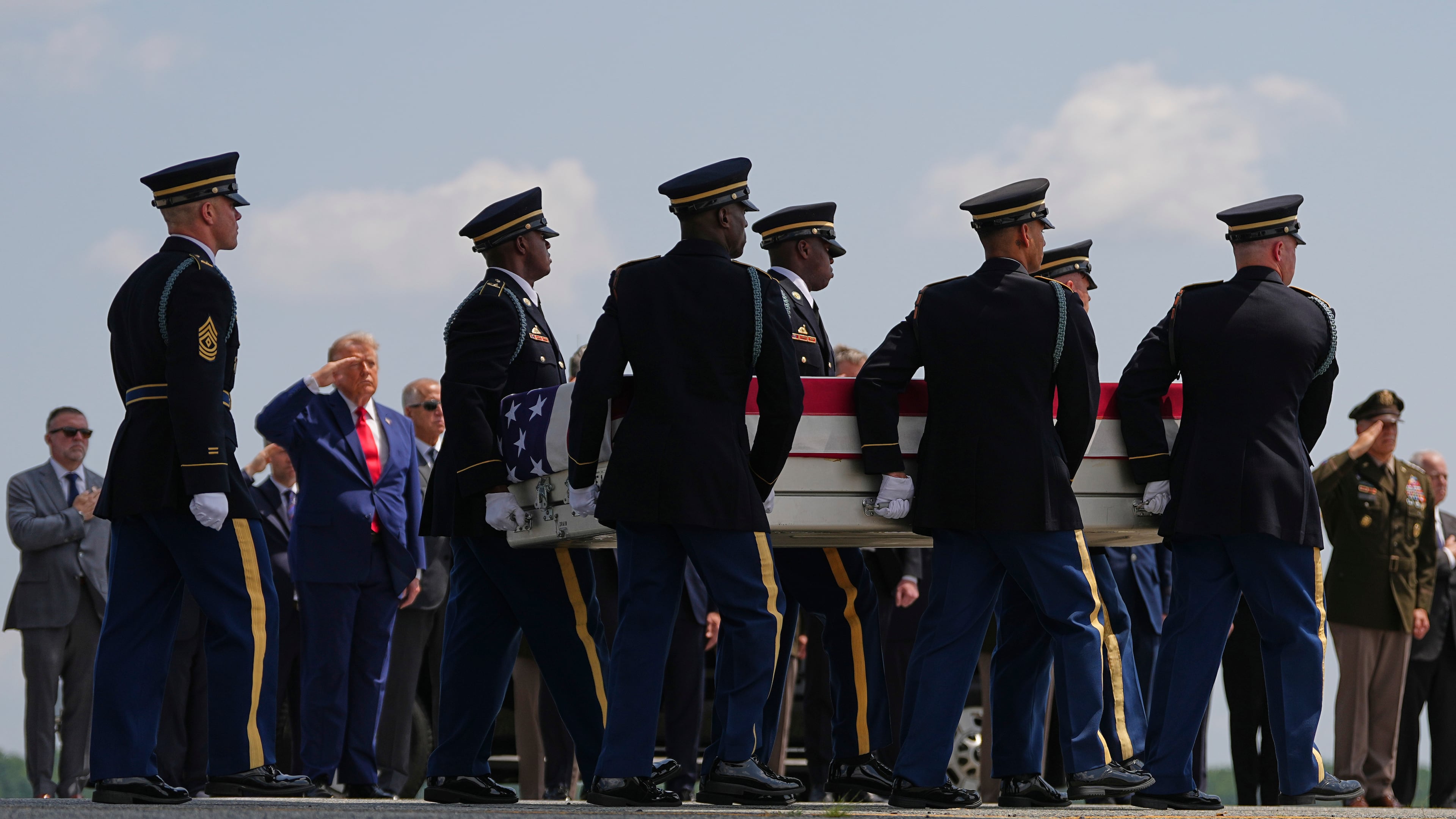 President Donald Trump salutes as a U.S. Army carry team moves a transfer case containing the remains of Pvt. Isabella Gonzales of Carrollton, Texas, Wednesday, July 22, 2026, at Dover Air Force Base, Del. (AP Photo/Matt Rourke)