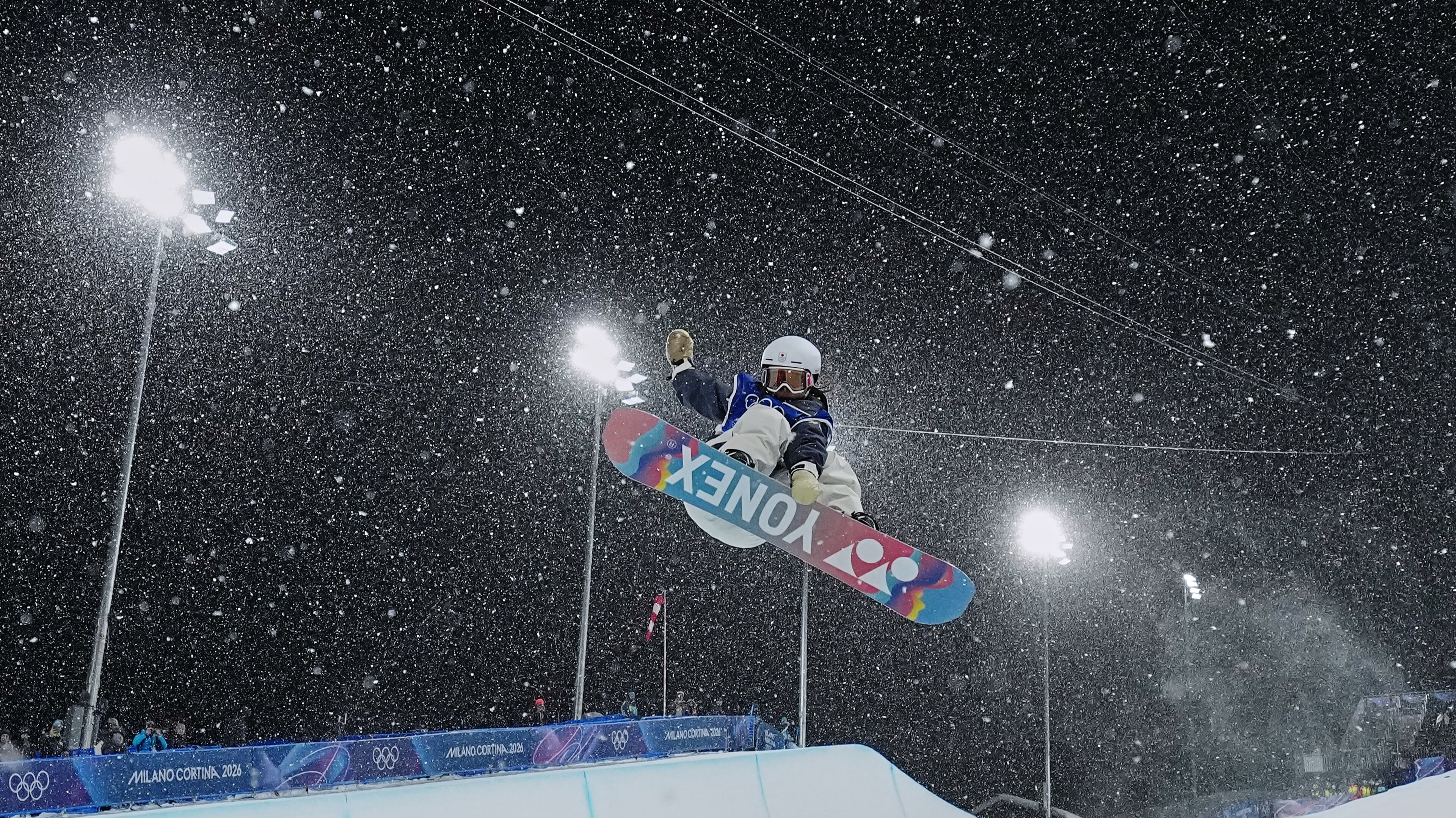 Japan's Sena Tomita competes during the women's snowboarding halfpipe finals at the 2026 Winter Olympics, in Livigno, Italy, Thursday, Feb. 12, 2026. (Gregory Bull/AP)