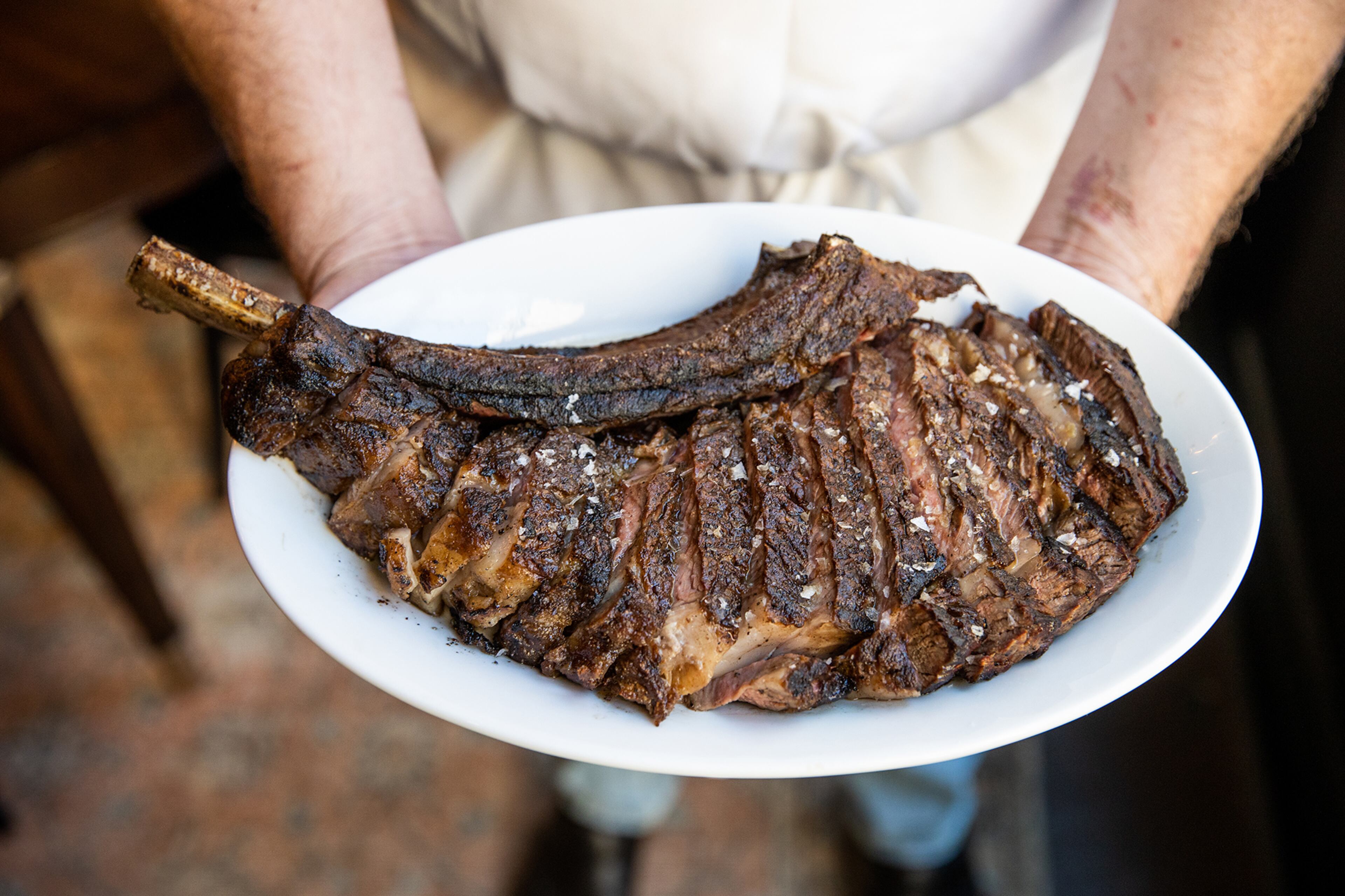 The 18-ounce prime bone-in ribeye fills the plate at Helen in Birmingham, Alabama.
Courtesy of Caleb Chancey