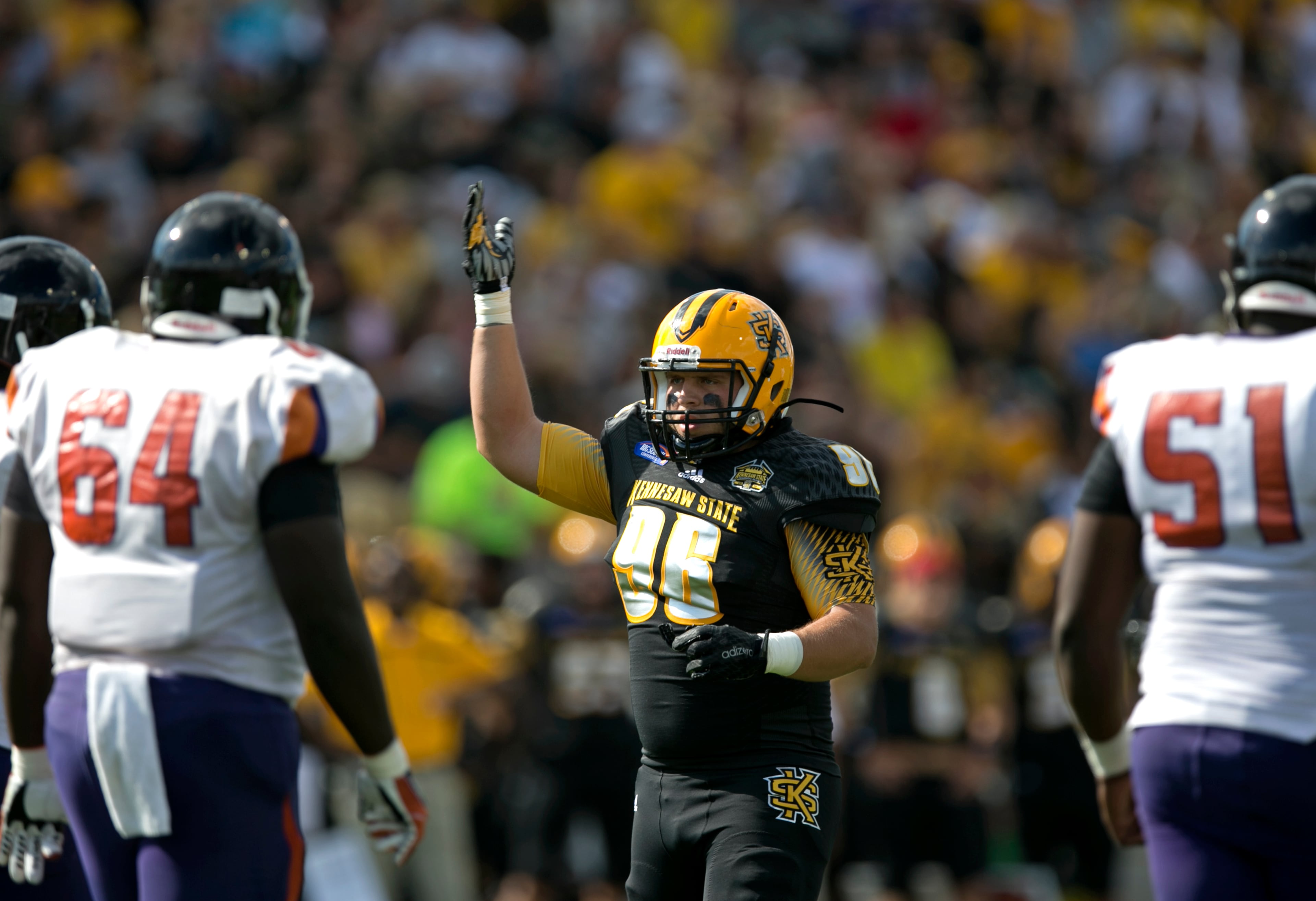 September 12, 2015 - Kennesaw, Ga: Kennesaw State University defensive lineman Nick Perrotta (96) gets the crowd fired up before a play against Edward Waters in the first quarter at Fifth Third Bank Stadium, Saturday, September 12, 2015, in Kennesaw, Ga.. This is the first home game of KSU's inaugural football season. PHOTO / JASON GETZ