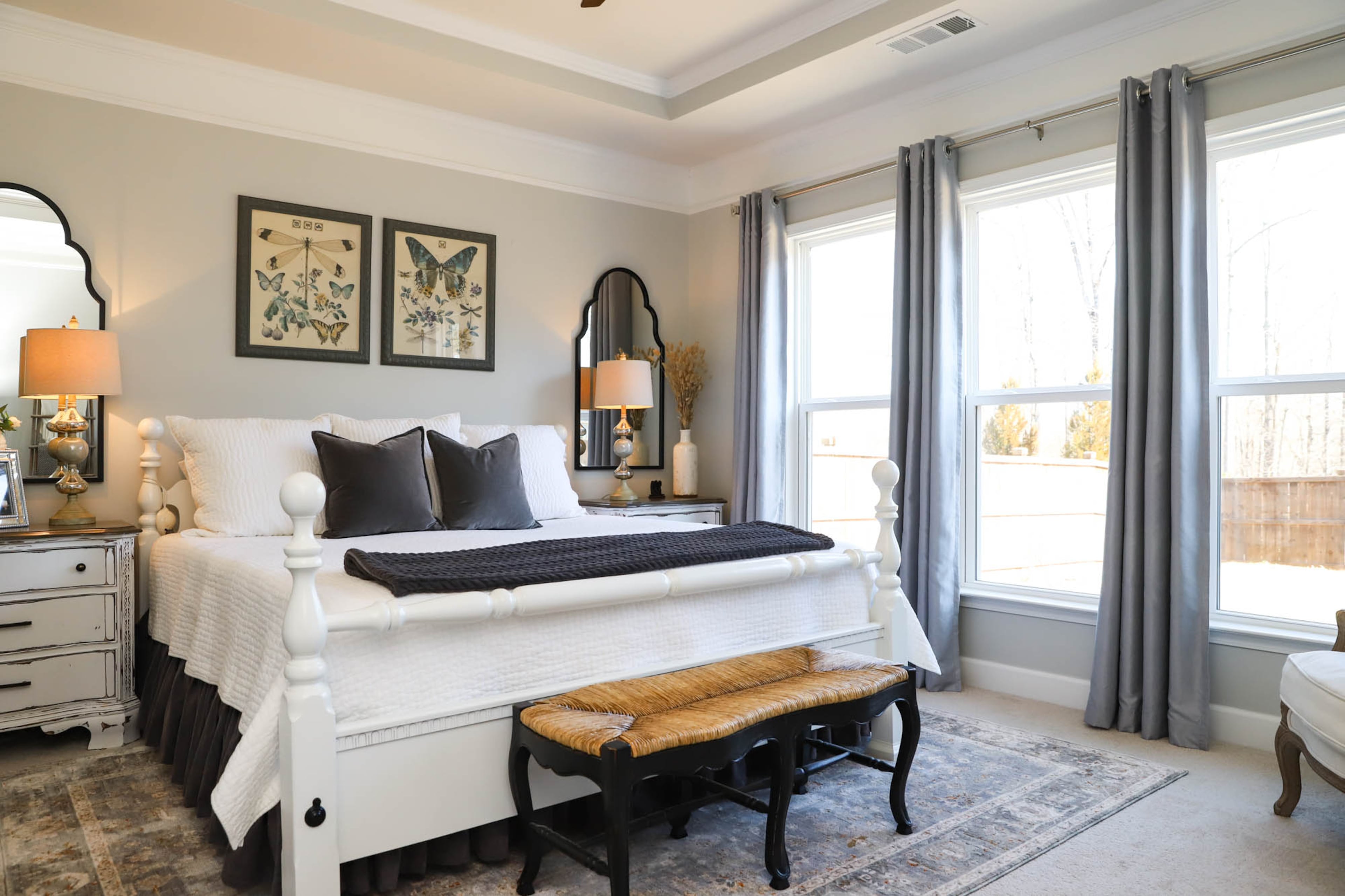 The owner’s suite is one of the spaces in Brenda and Logan Lineberry’s home that has gotten a recent decor touch-up. The bedside tables are antiques upcycled by Out of the Cedar Chest, and both the rug and bench at the foot of the bed were purchased at HomeGoods. The butterfly and dragonfly prints over the bed were purchased on Facebook Marketplace. Text by Shannon Dominy/Photo by Reynolds Rogers