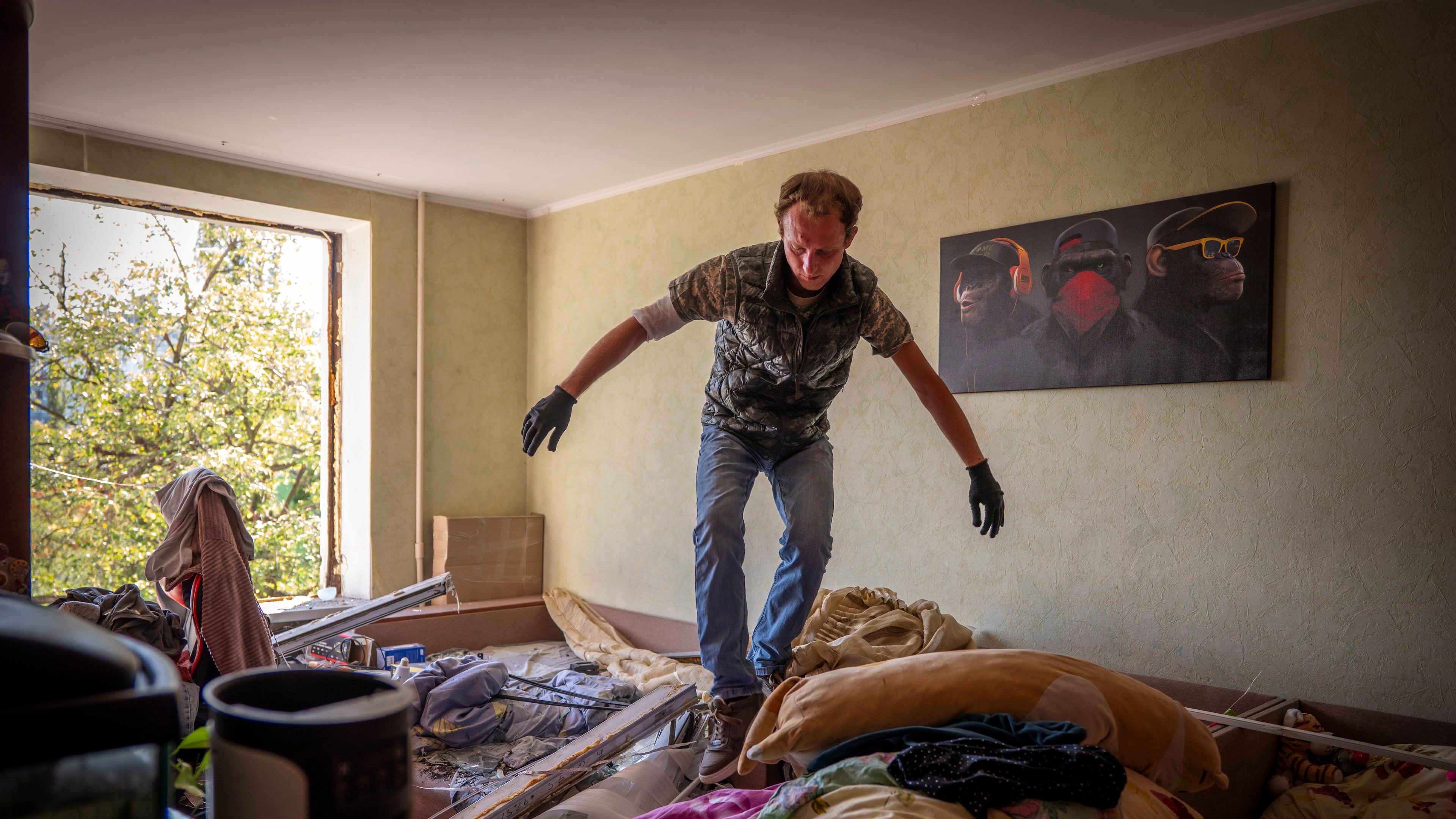 A man inspects damage to his apartment after a Russian missile exploded near his home in Kyiv, Ukraine, Thursday, Sept. 17, 2026. (AP Photo/Dan Bashakov)
