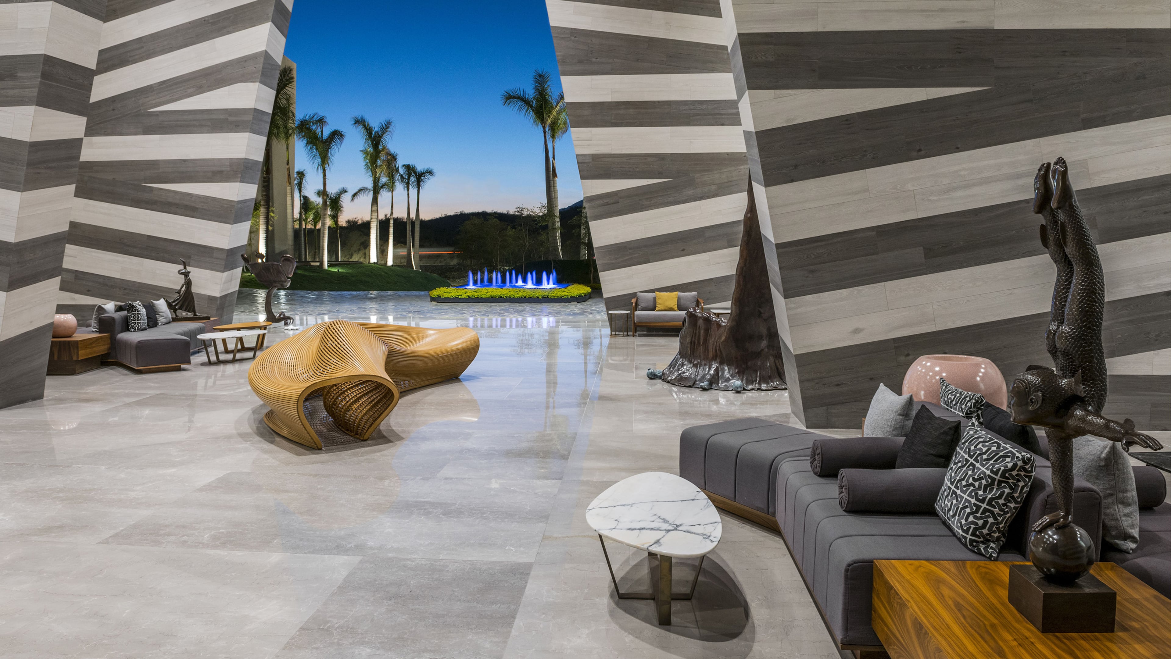 The curved, half-moon design of the hotel catches eyes with an iconic grand entrance thatâs open air, three stories high and over 300 feet above sea level. (Victor Elias/Grand Velas Los Cabos)