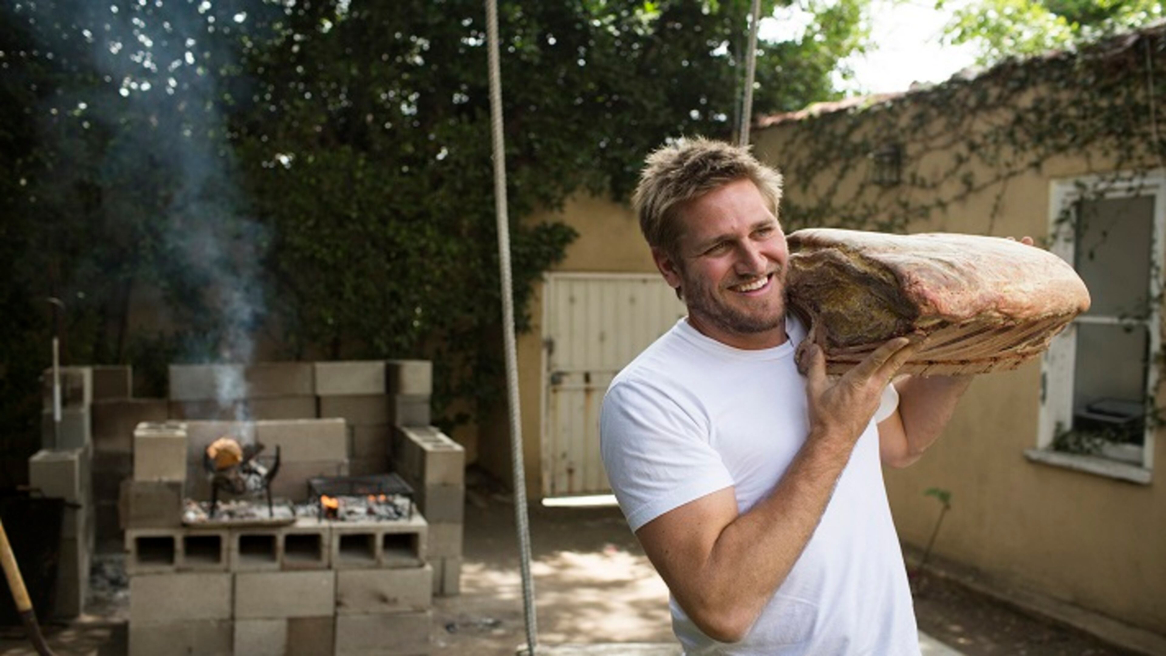 Australian chef Curtis Stone holds a piece of meat at his test kitchen in Beverly Hills, Calif., on June 10, 2016. Stone plans to open a new meat-centric restaurant in Hollywood with his brother, Luke Stone. (Dillon Deaton/Los Angeles Times/TNS)