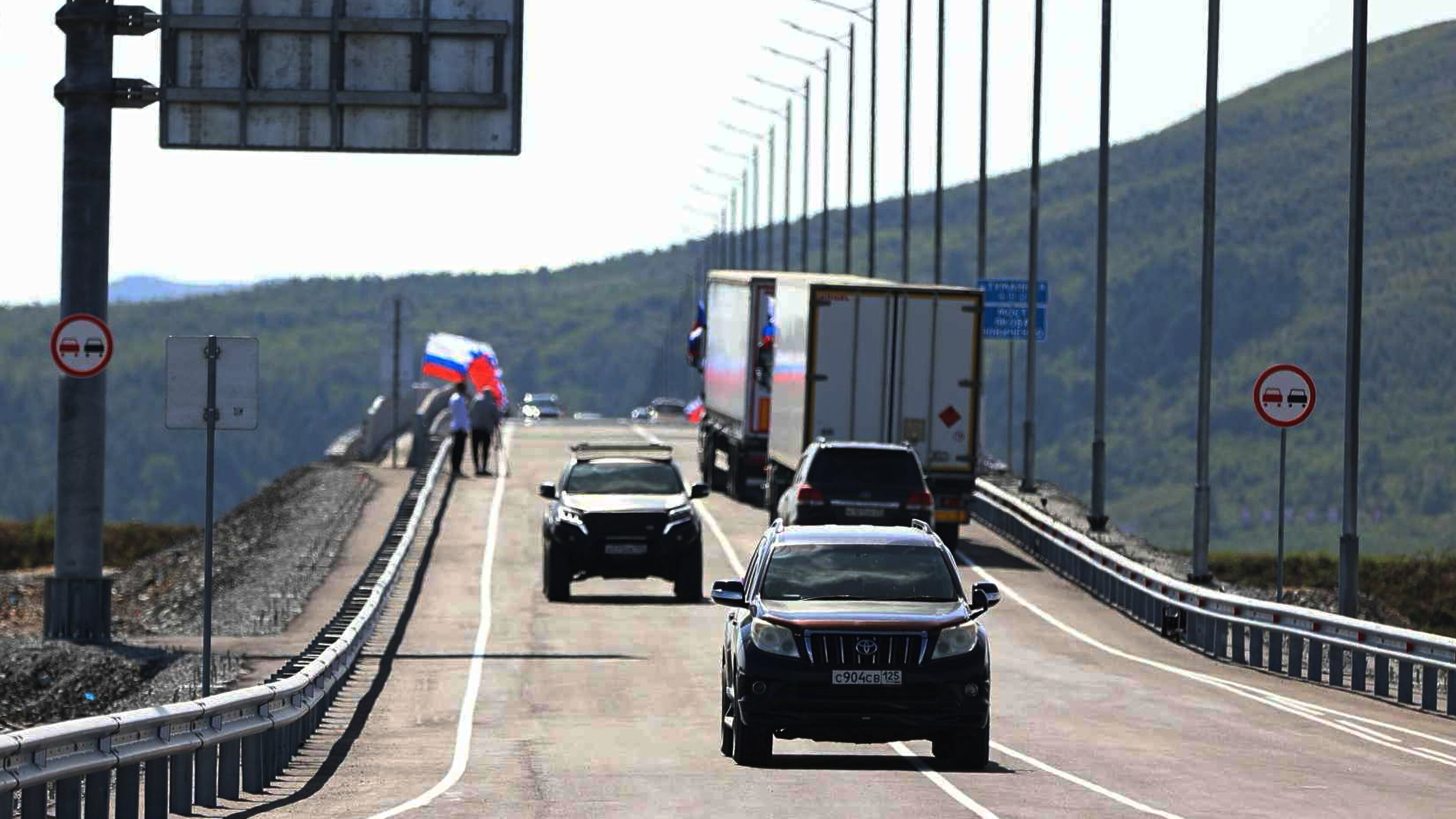 In this photo released by the Government of Primorsky Krai Region on Monday, Sept. 7, 2026, vehicles drive across the new bridge between Russia and North Korea named after the Soviet officer Yakov Novichenko, who is credited with saving North Korea's founding leader, Kim Il-sung, over the Tumannaya River in Primorsky Krai Region of Russia. (Dmitry Ignatenko/Government of Primorsky Krai Region via AP)