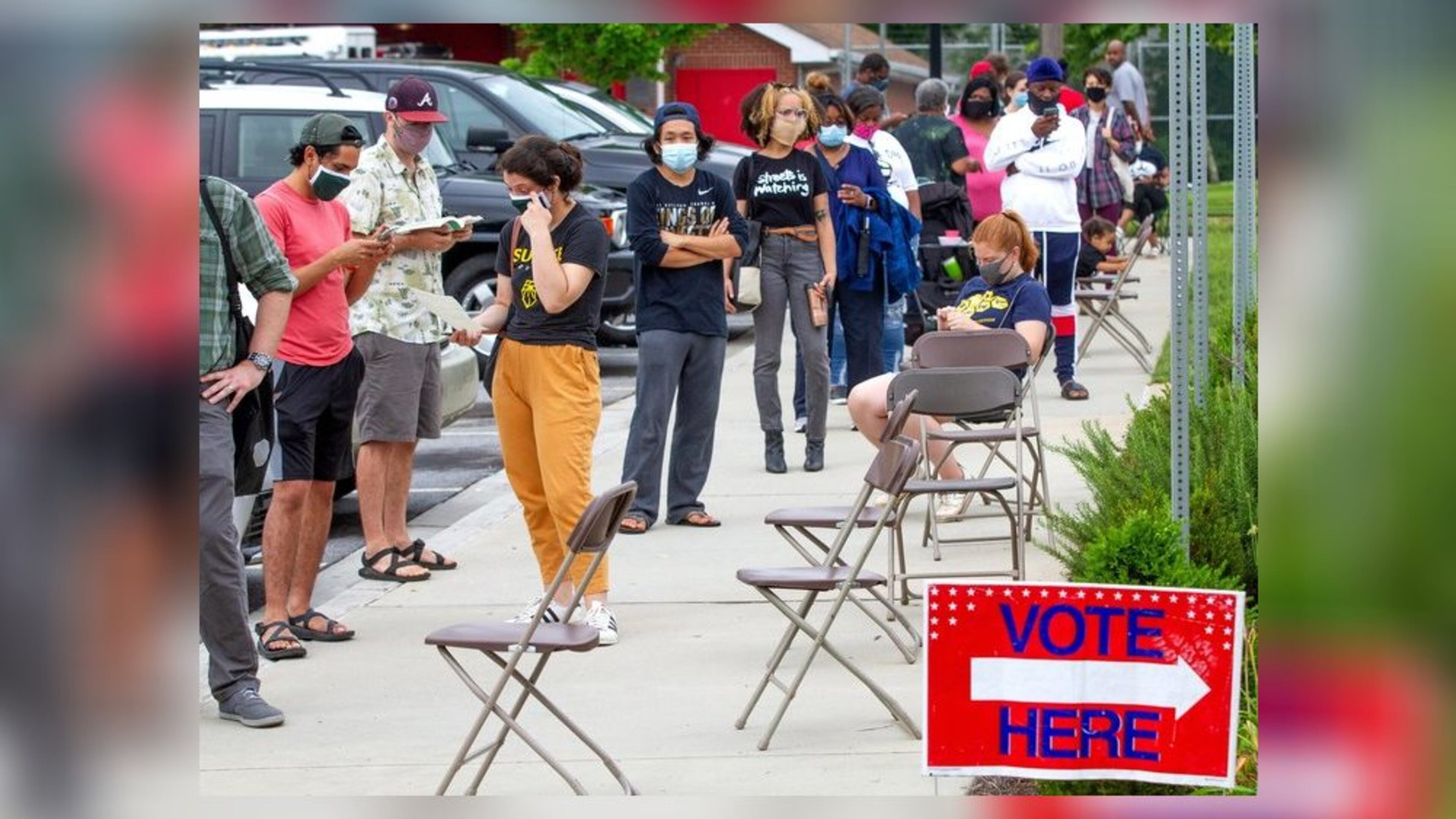 Voters wait in a line Tuesday that stretched around the Metropolitan Library. STEVE SCHAEFER FOR THE ATLANTA JOURNAL-CONSTITUTION