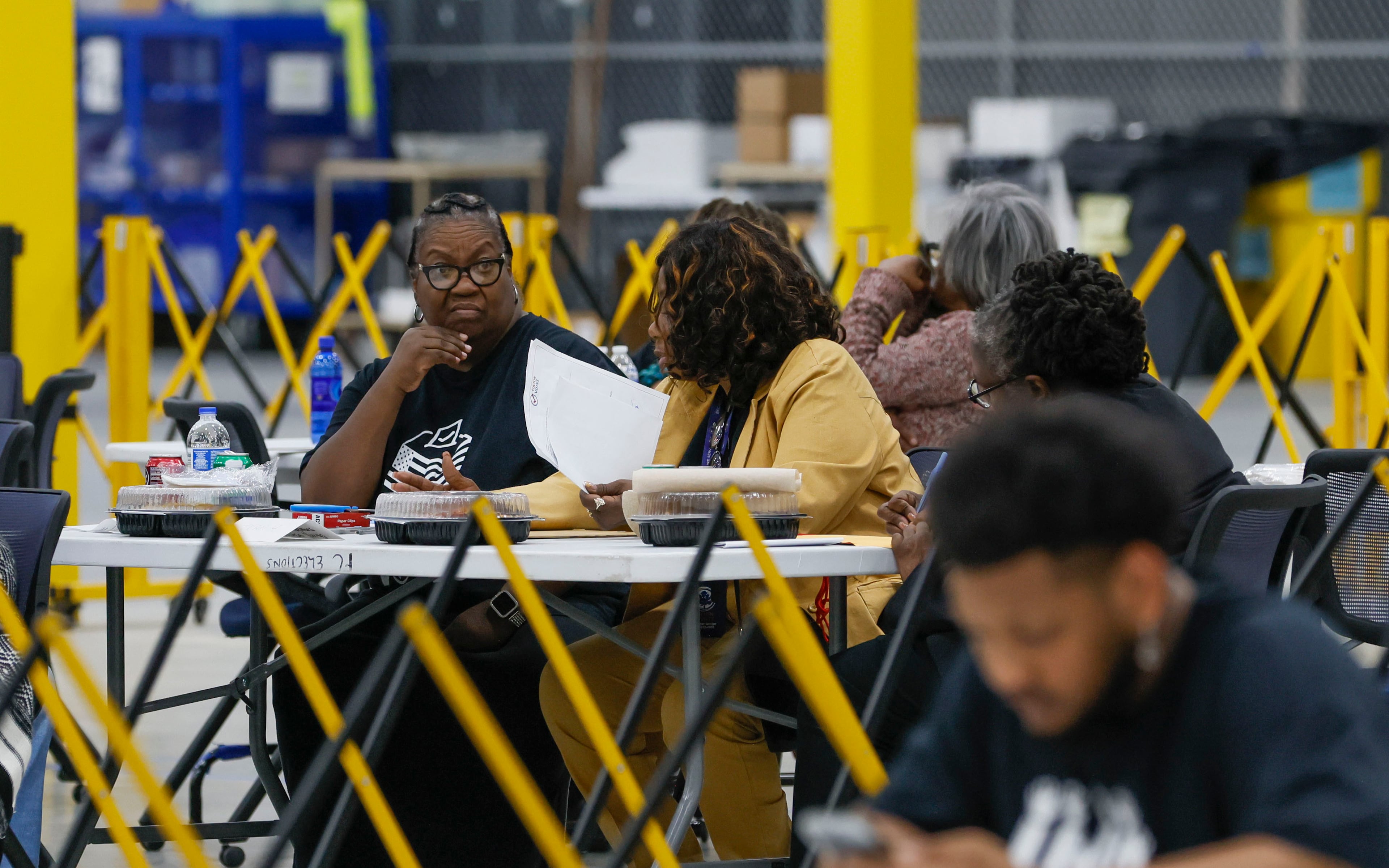 Election workers wait for ballots to arrive at the Fulton County Election Center during the 2026 Georgia primary elections. (Bob Andres for the AJC)