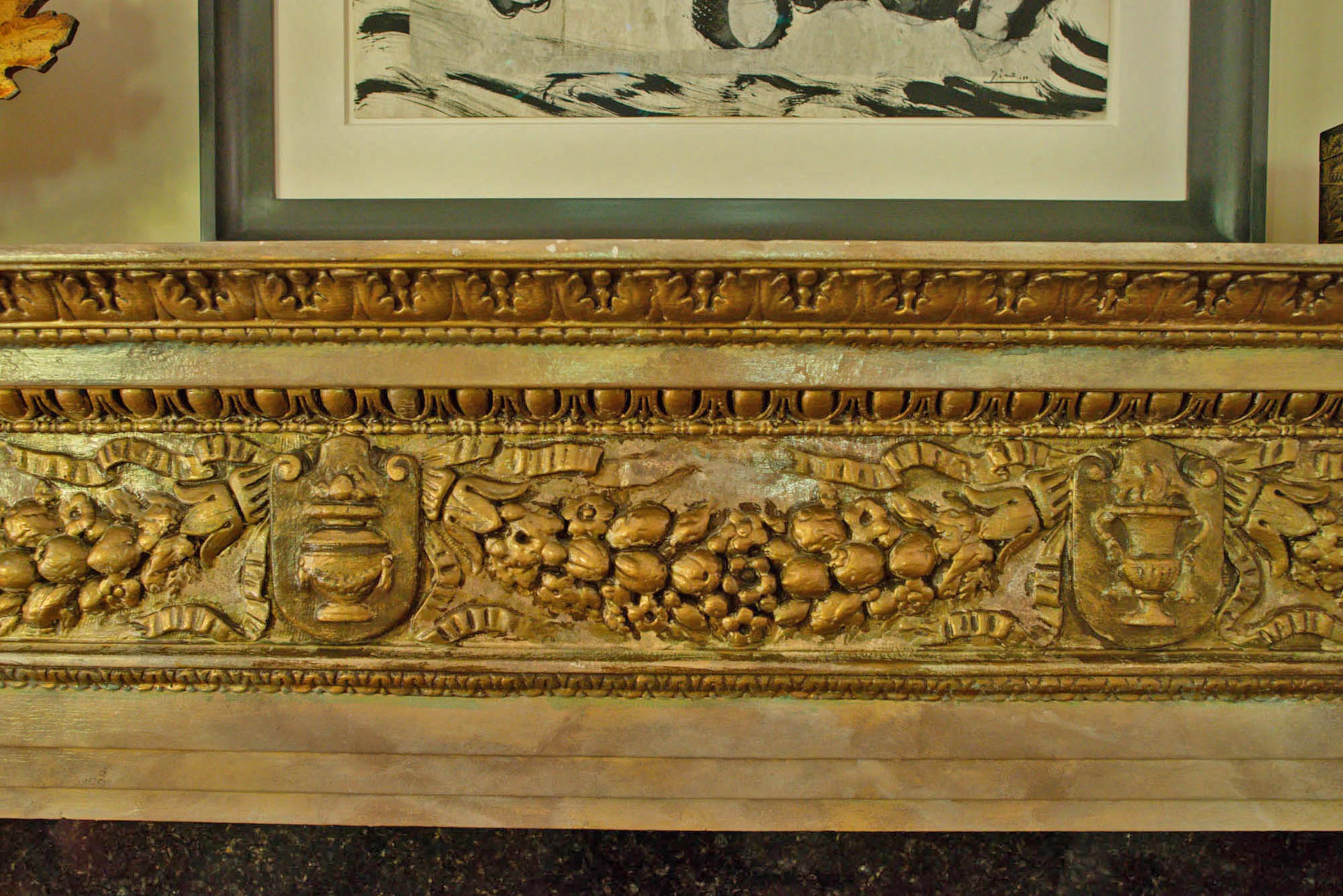 The fireplace surround in the salon is original to the house, but homeowner Judy Ragunas said a previous owner painted it.