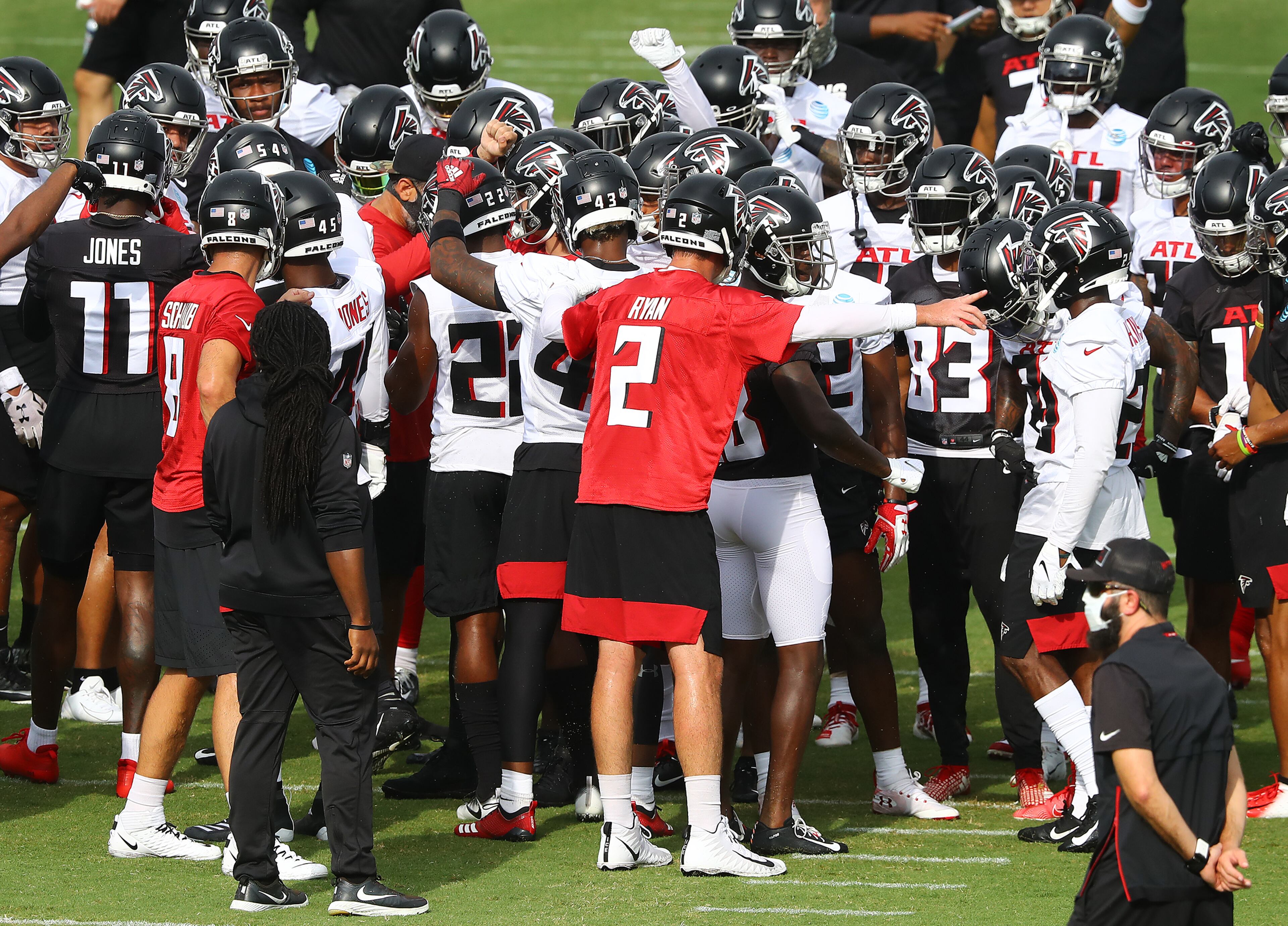 The Falcons, led by quarterback Matt Ryan (2), take the field to begin a day of training camp on Saturday, August 15, 2020 in Flowery Branch. Curtis Compton ccompton@ajc.com