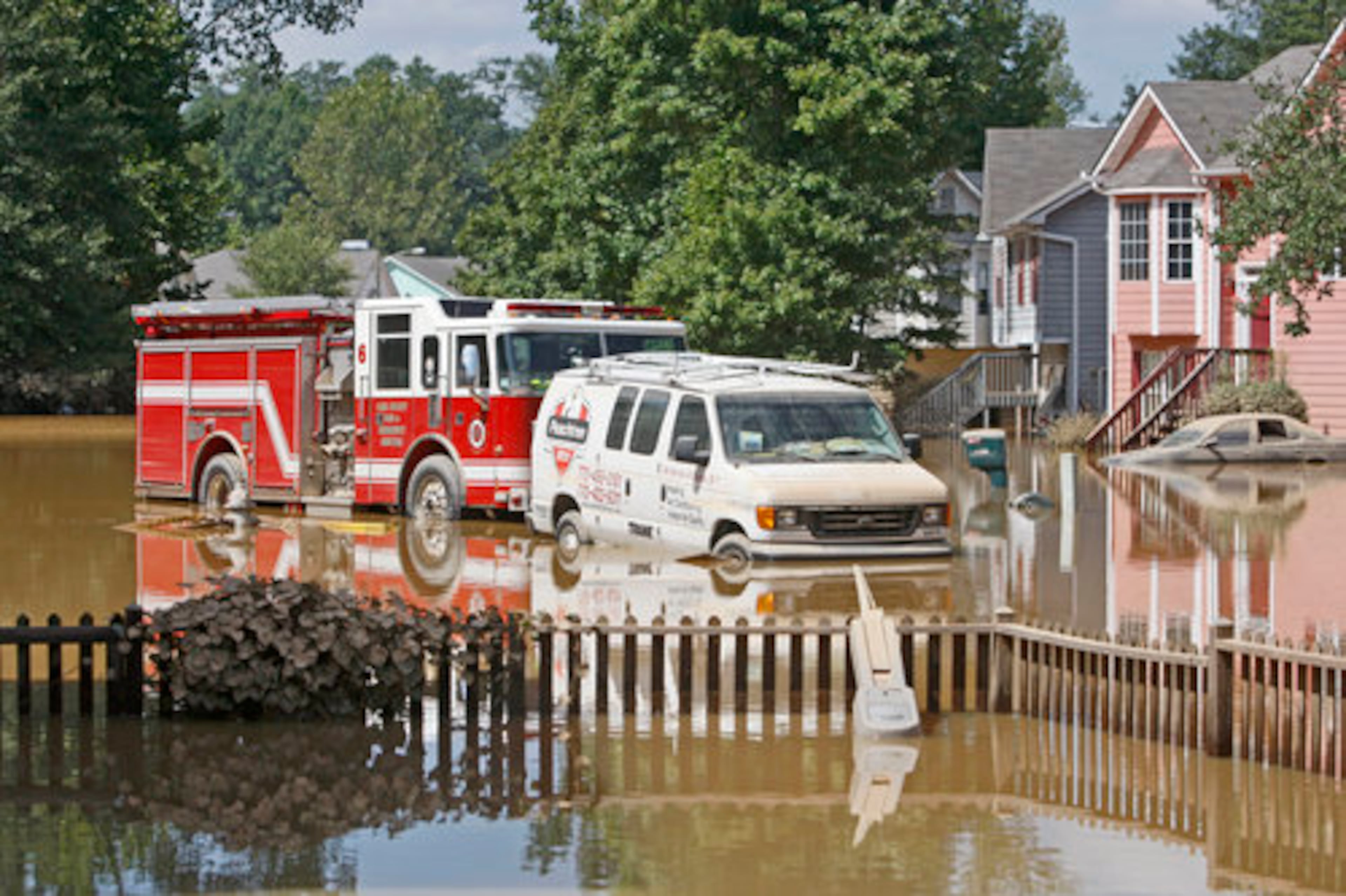 The abandoned fire trucks that tried to save his house.