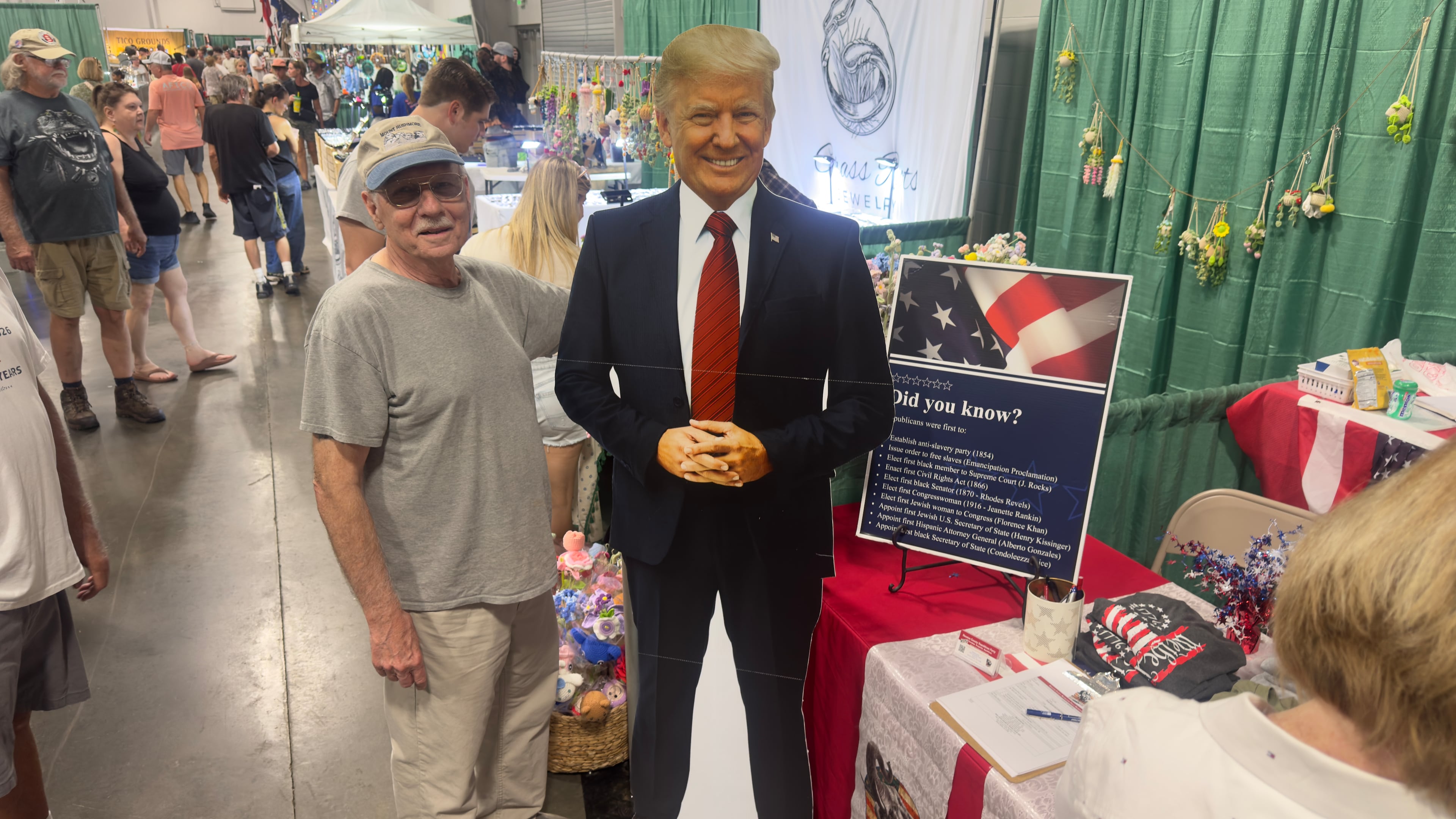 Jerry Mitchell of Covington poses with a cardboard cutout of Donald Trump at a campaign booth run by the Houston County Republican Party at the Georgia National Fair in Perry. (Joe Kovac Jr./AJC)