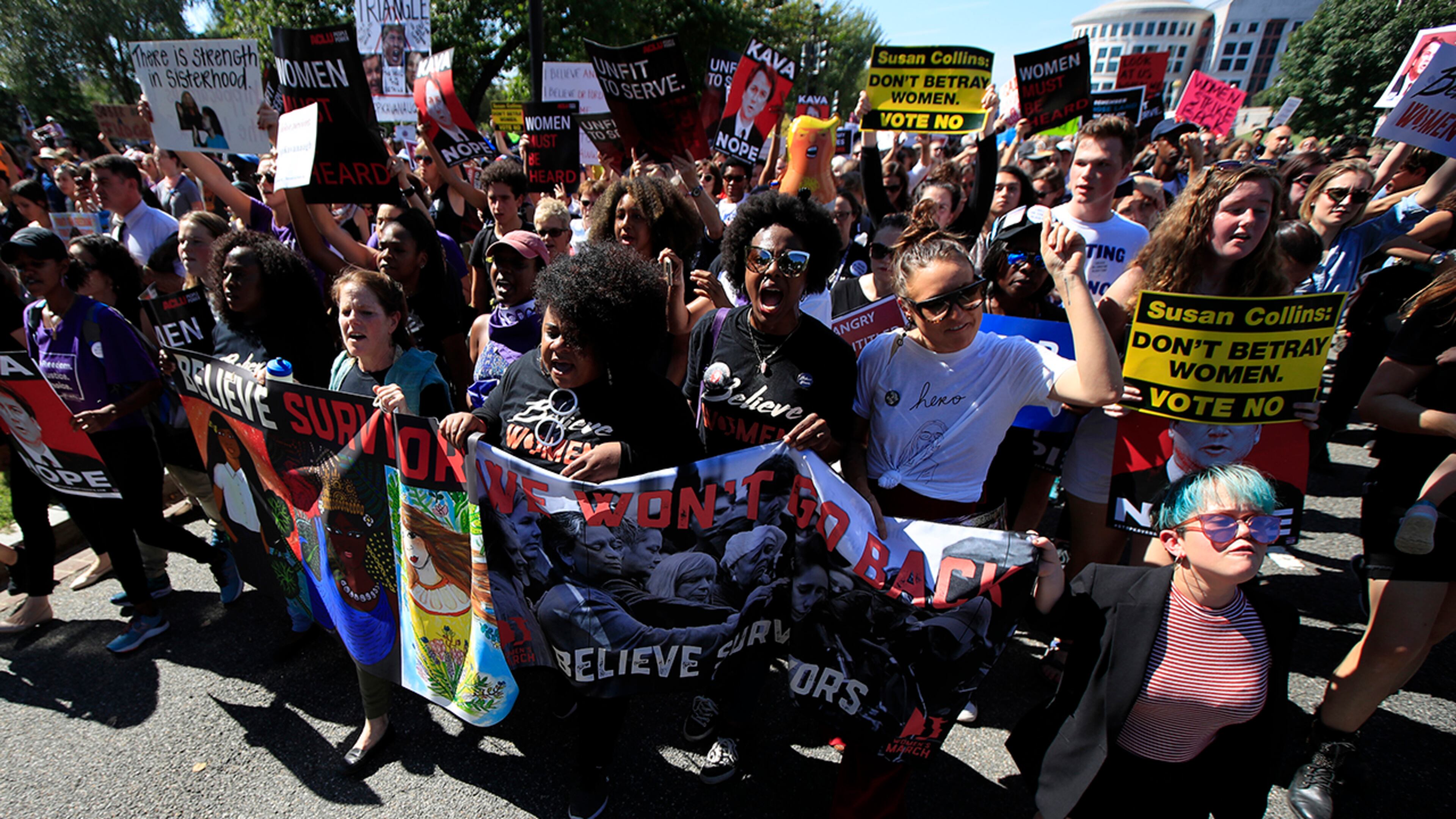 Protesters against Supreme Court nominee Brett Kavanaugh march towards the Supreme Court in Washington, Thursday, Oct. 4, 2018. (AP Photo/Manuel Balce Ceneta)
