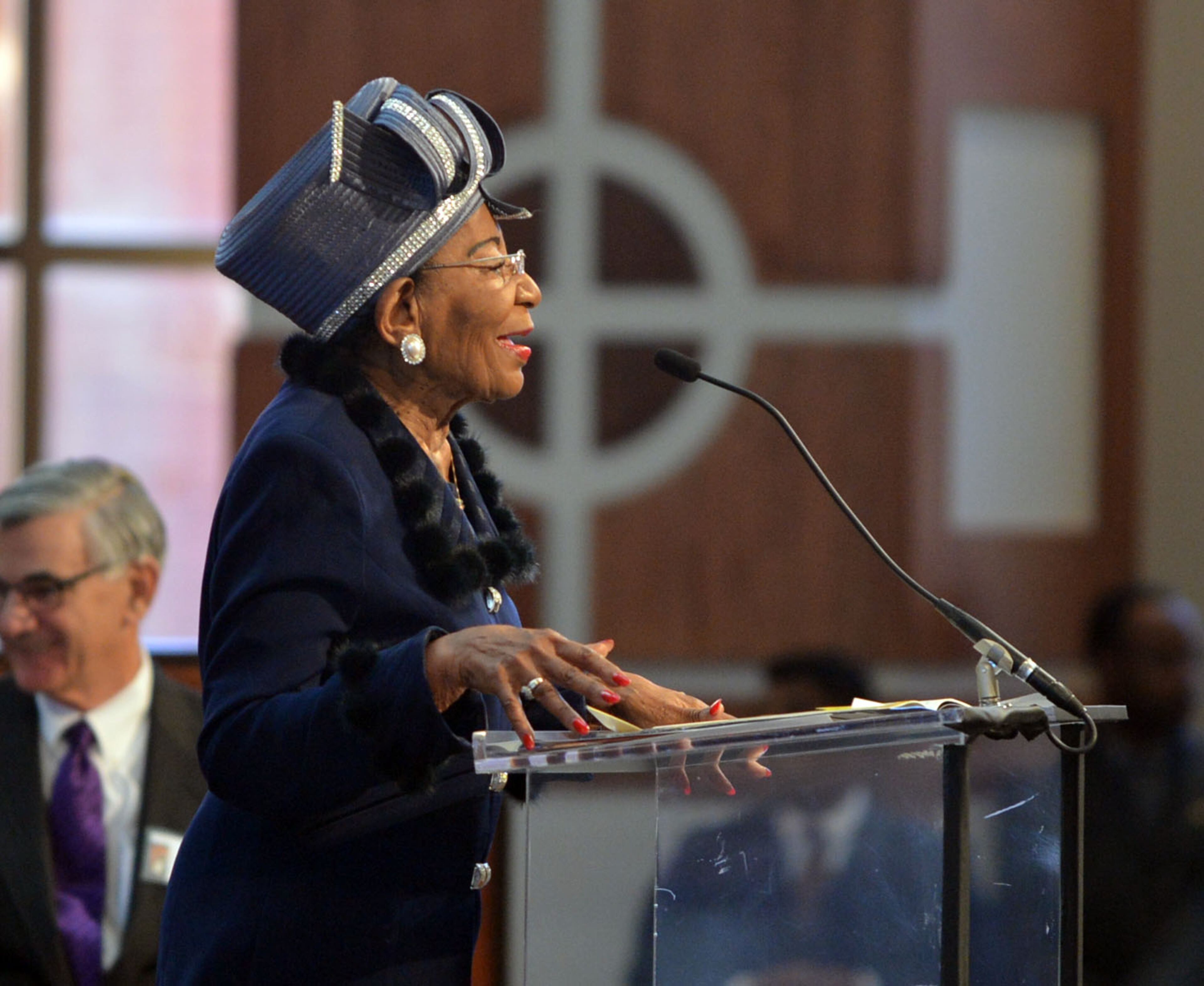 Dr. Christine King Farris presides over the service.