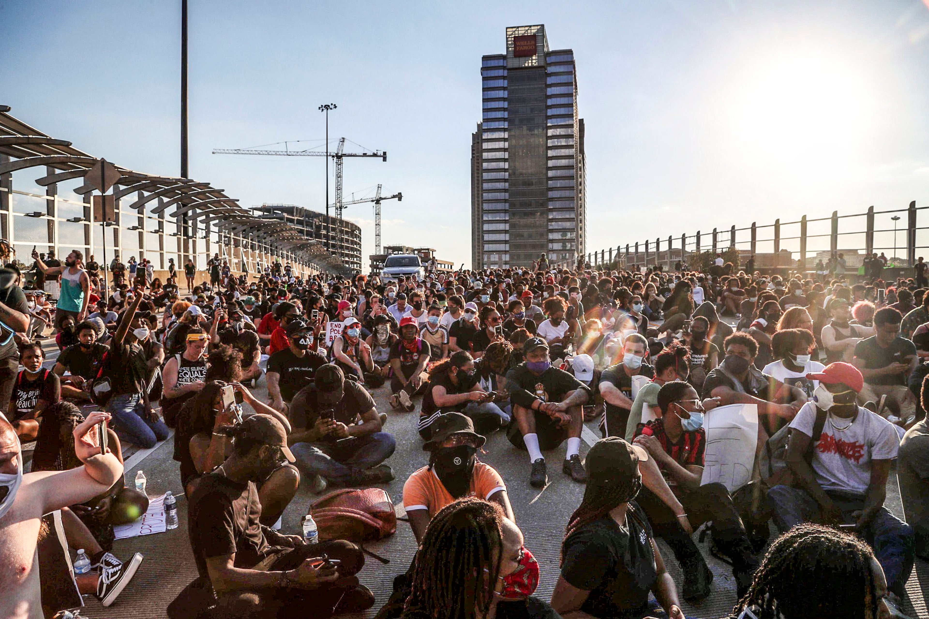 Protestors block the 17th St. bridge after they marched through downtown, after several different groups converged at a rally at Centennial Olympic park, including a protest sponsored by HCU students, who marched from Cleopas R. Johnson Park. They carried signs and chanted their messages of outrage over the death of George Floyd in Minneapolis. Alyssa Pointer / alyssa.pointer@ajc.com