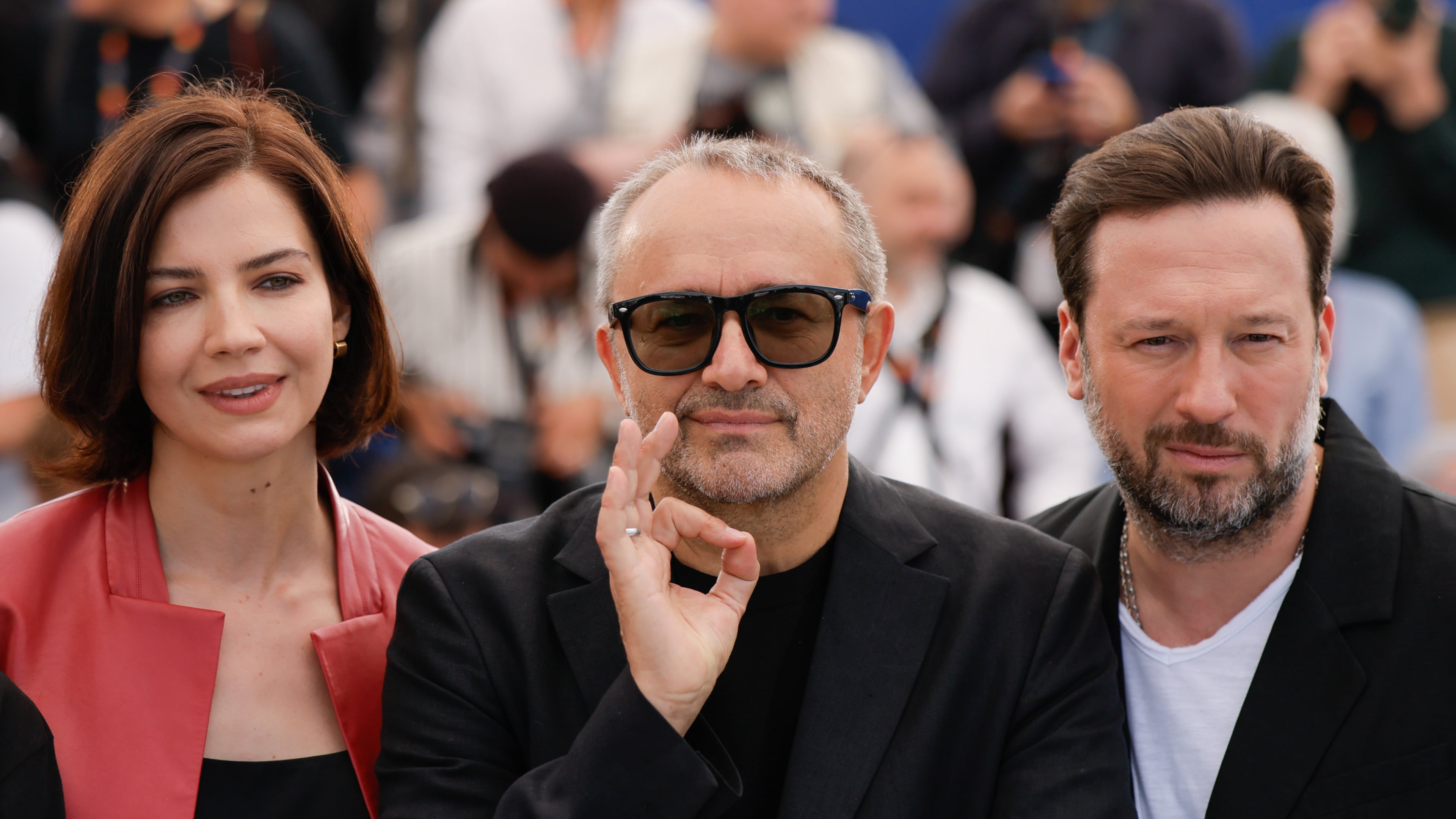Iris Lebedeva, director Andrey Zvyagintsev and Dmitriy Mazurov pose for photographers at the photo call for the film Minotaur' at the 79th international film festival, Cannes, southern France, Wednesday, May 20, 2026. (Photo by Millie Turner/Invision/AP)