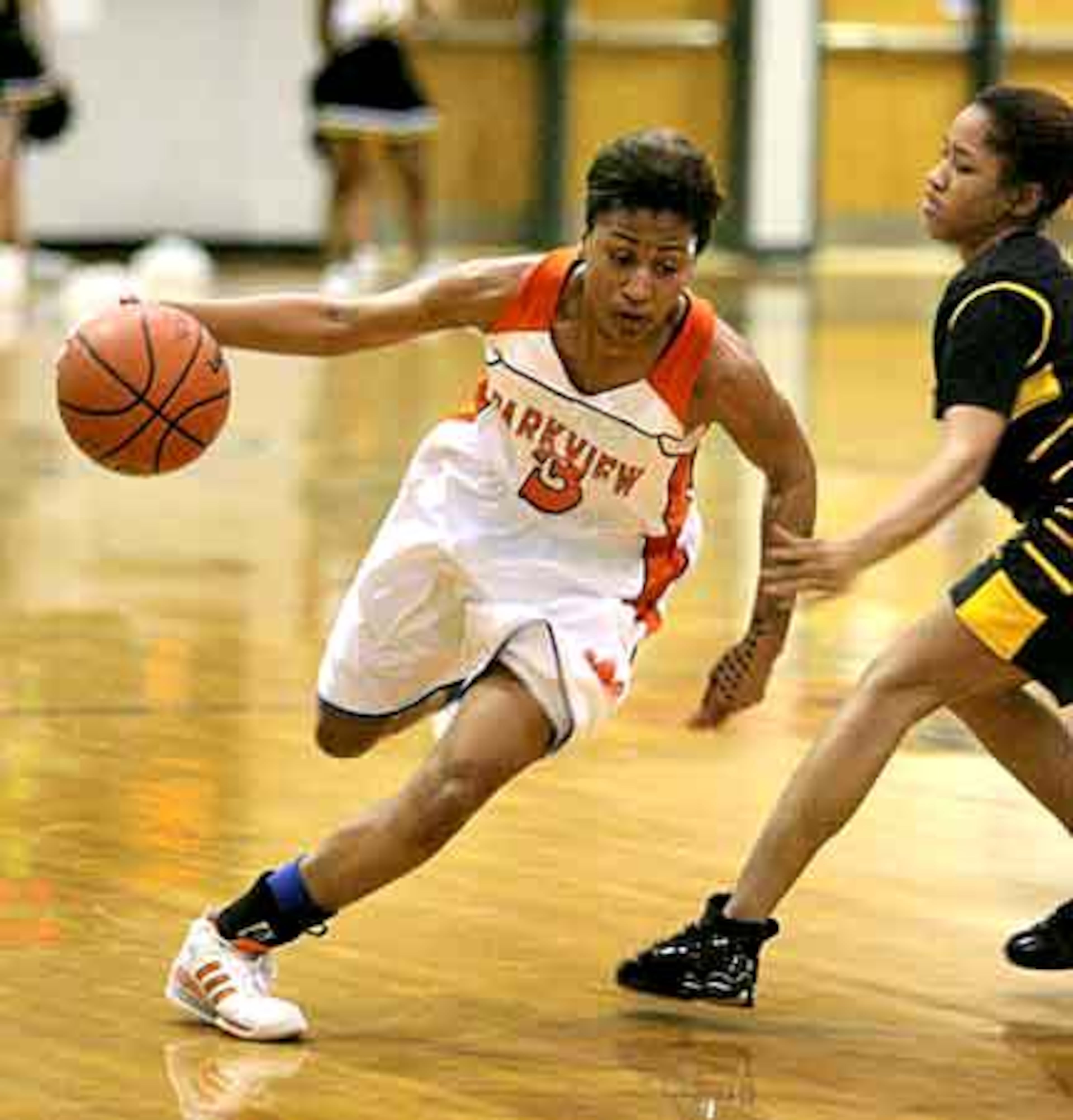 Sczeny Hartry drives past Central Gwinnett's CeAira Latimore during their final at South Gwinnett High School in Snellville.