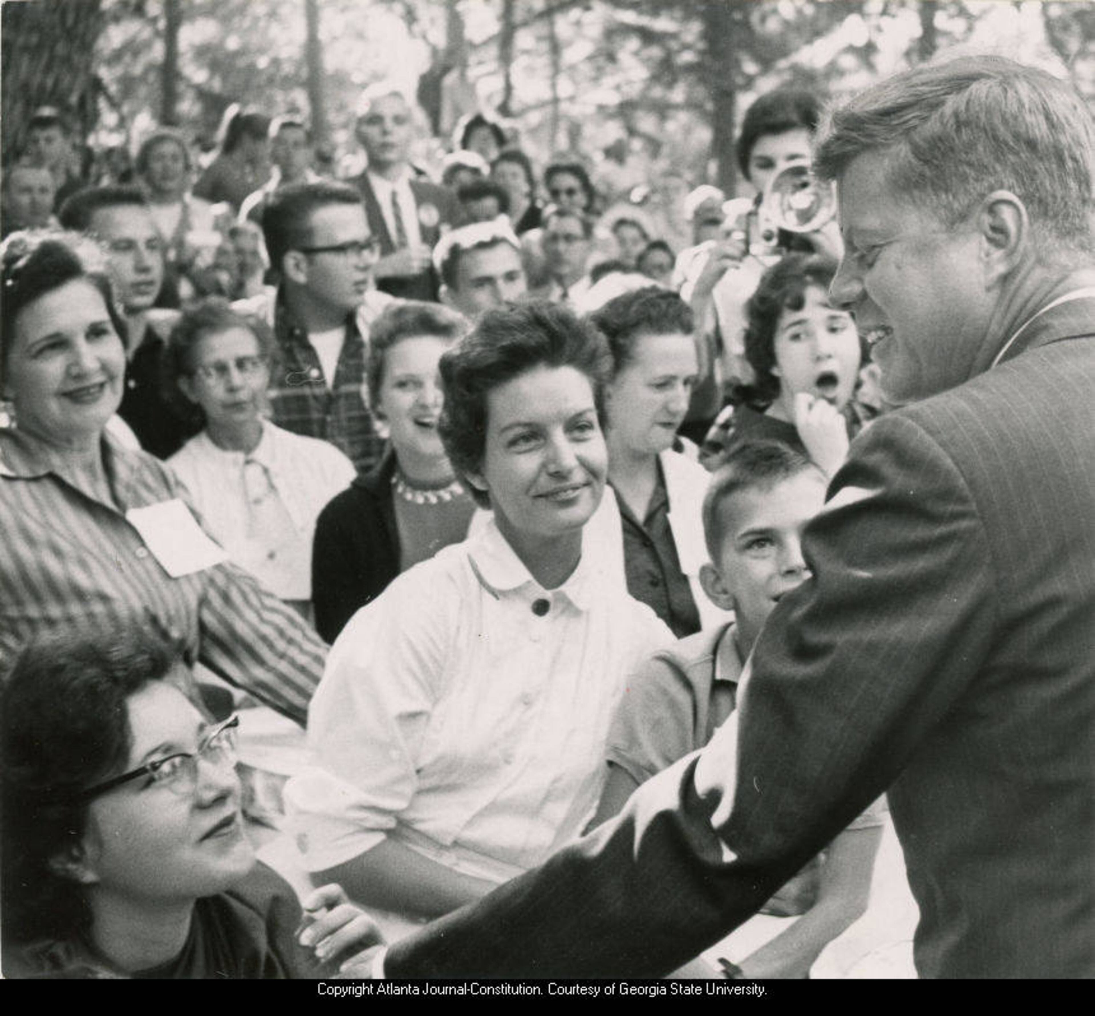 John F. Kennedy shaking hands with patients at the Georgia Warm Springs Foundation, Warm Springs, Georgia, during the presidential campaign, October 10, 1960. Atlanta Journal-Constitution Photographic Archive