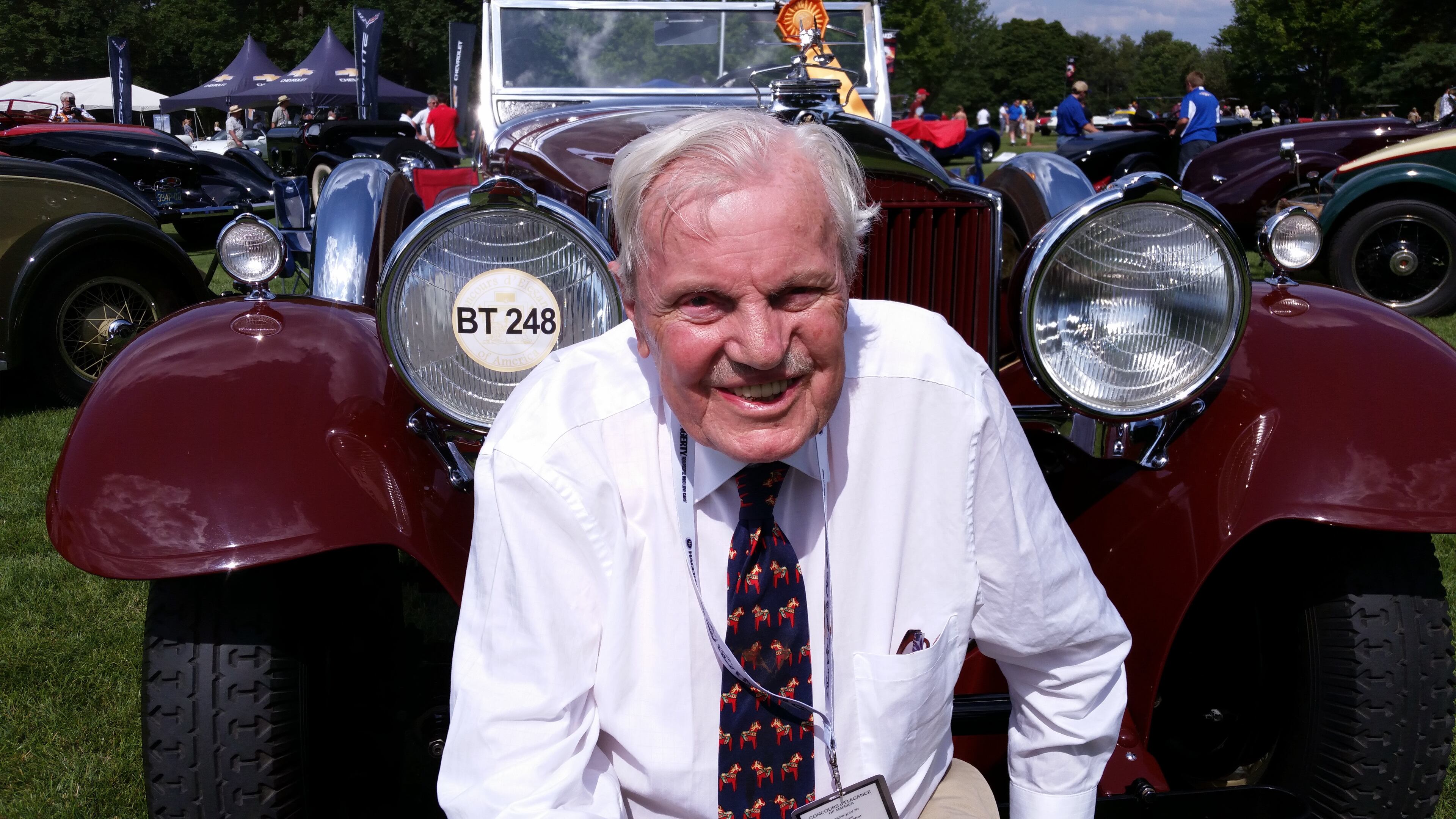 Don Peterson was editor and owner of Car Collector magazine, an expert appraiser of classic cars, and a board member of the Classic Car Club of America in front of his burgundy 1930 Packard 734 Speedster, only six of which still exist.