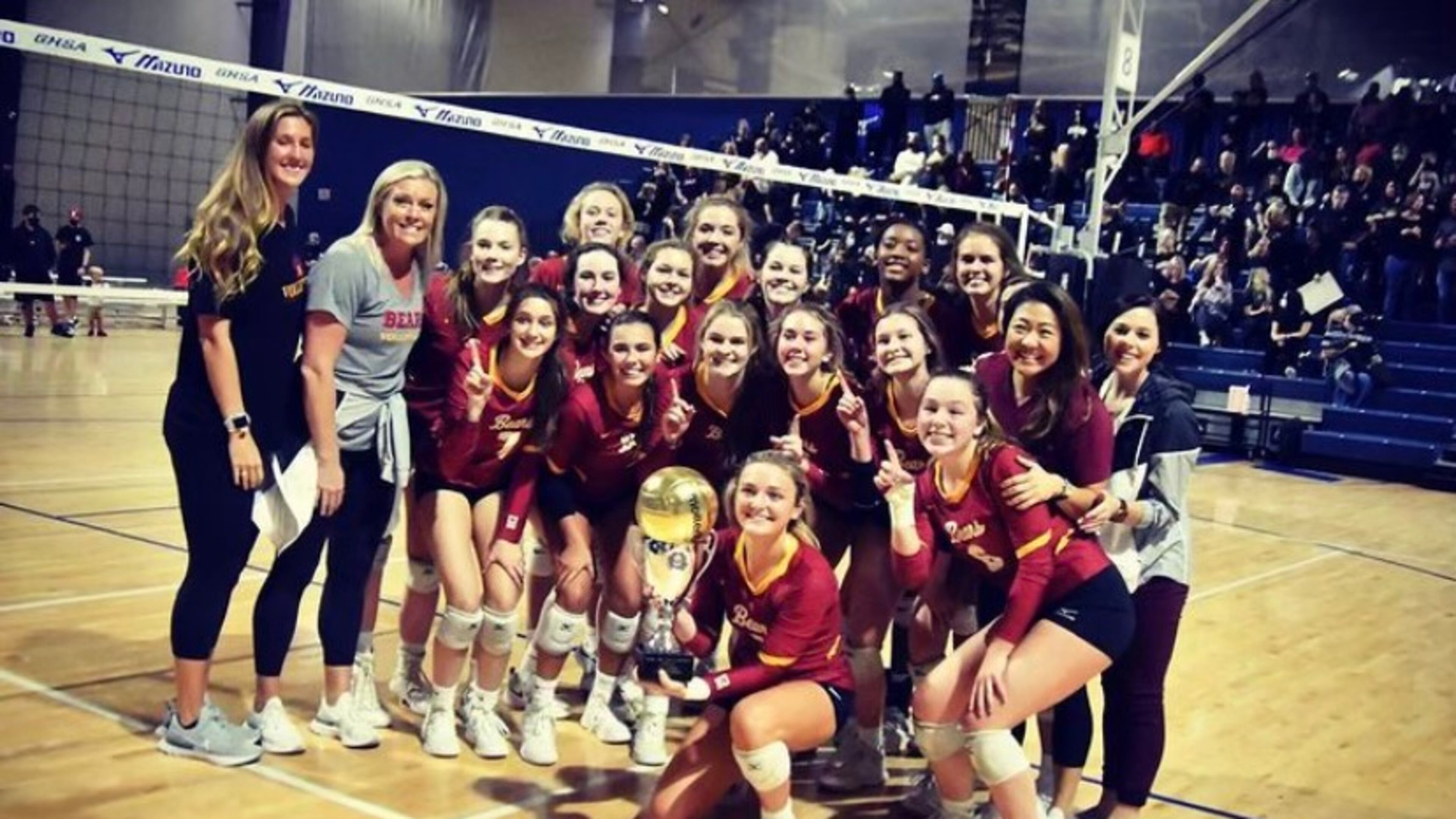 Holy Innocents Volleyball team celebrates after winning a Georgia State Championship. They played 30-plus matches in 2020, with all teams following the COVID protocol.