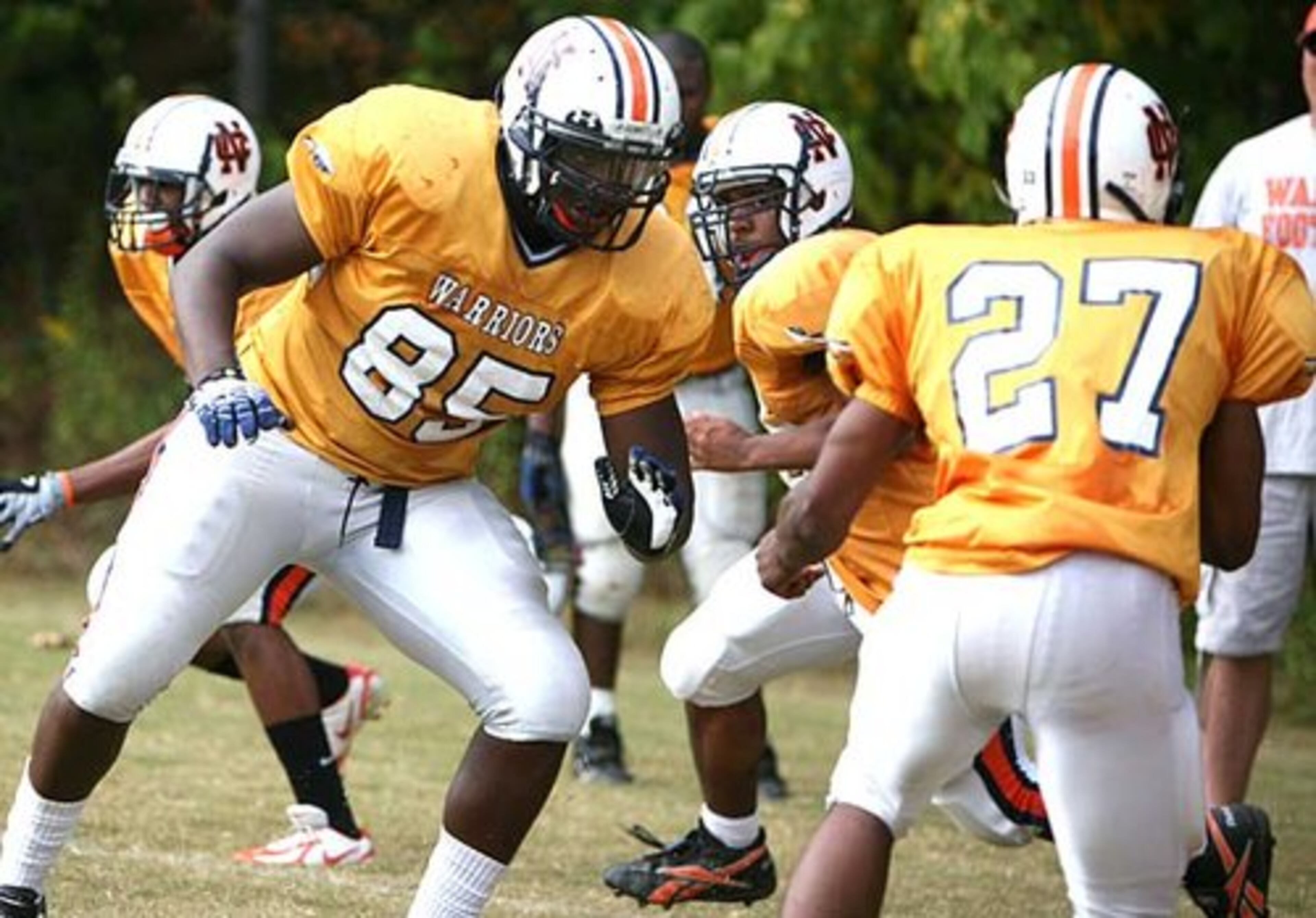 Lott (85, left) has been offered by UGA. He's also considering Louisville, Mississippi, Oklahoma State, South Carolina and Southern California.