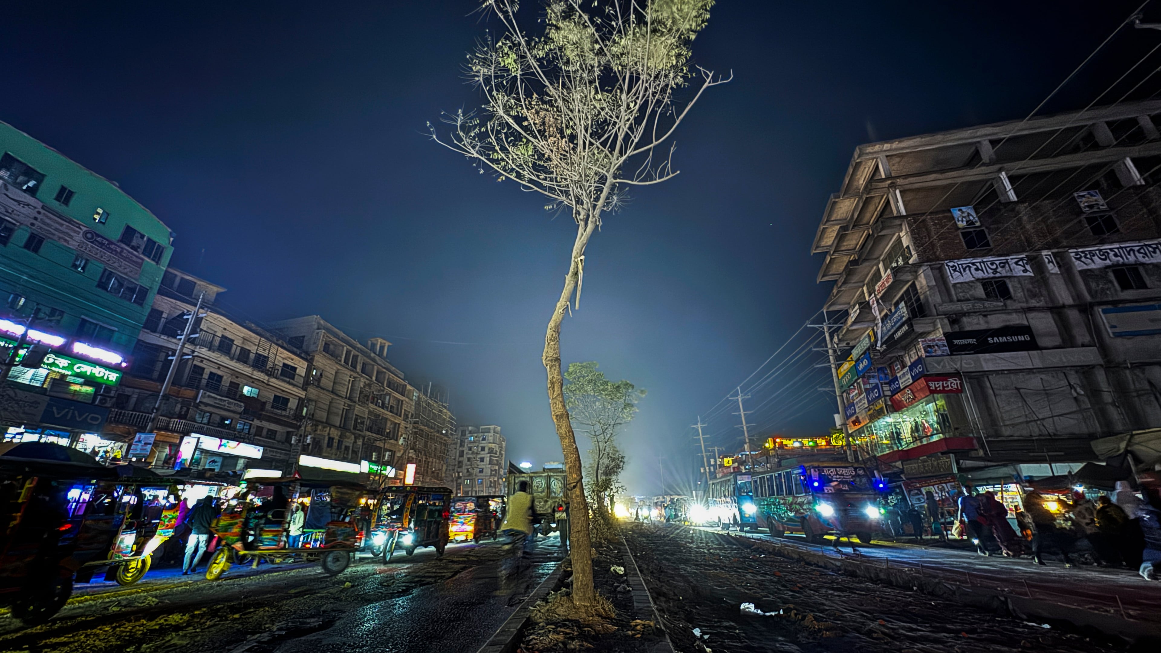A tree stands on a road divider where the body of 27-year-old Hindu garment worker Dipu Chandra Das was hung and set on fire by a mob on Dec. 18, 2025, in Gazipur near Dhaka, Bangladesh, Jan. 9, 2026. (AP Photo/Mahmud Hossain Opu)