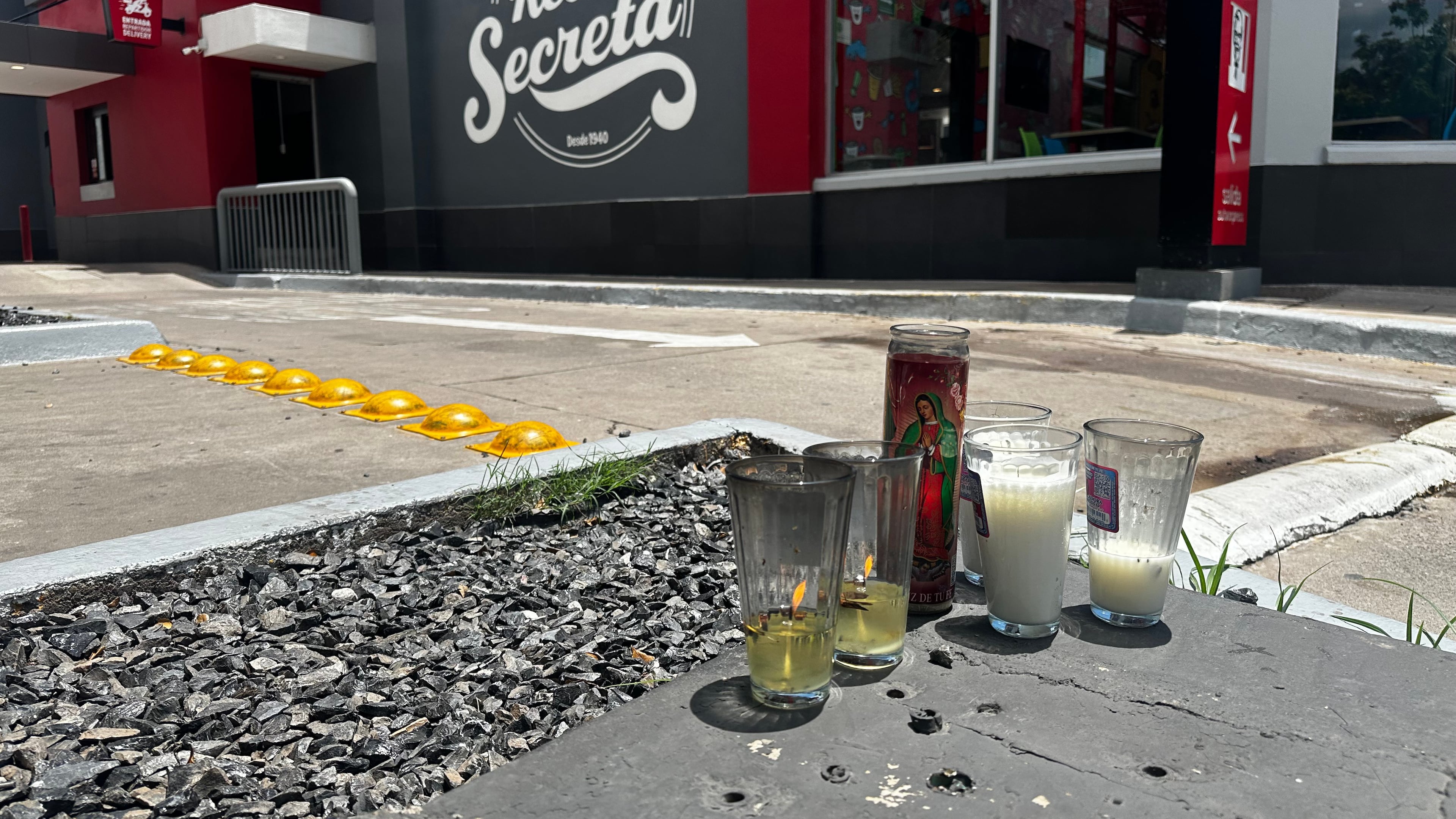 Candles sit near the spot where César Gastélum, a social media influencer, was killed the previous night in Culiacán, Mexico, Wednesday, Aug. 5, 2026. (AP Photo/Aaron Ibarra)