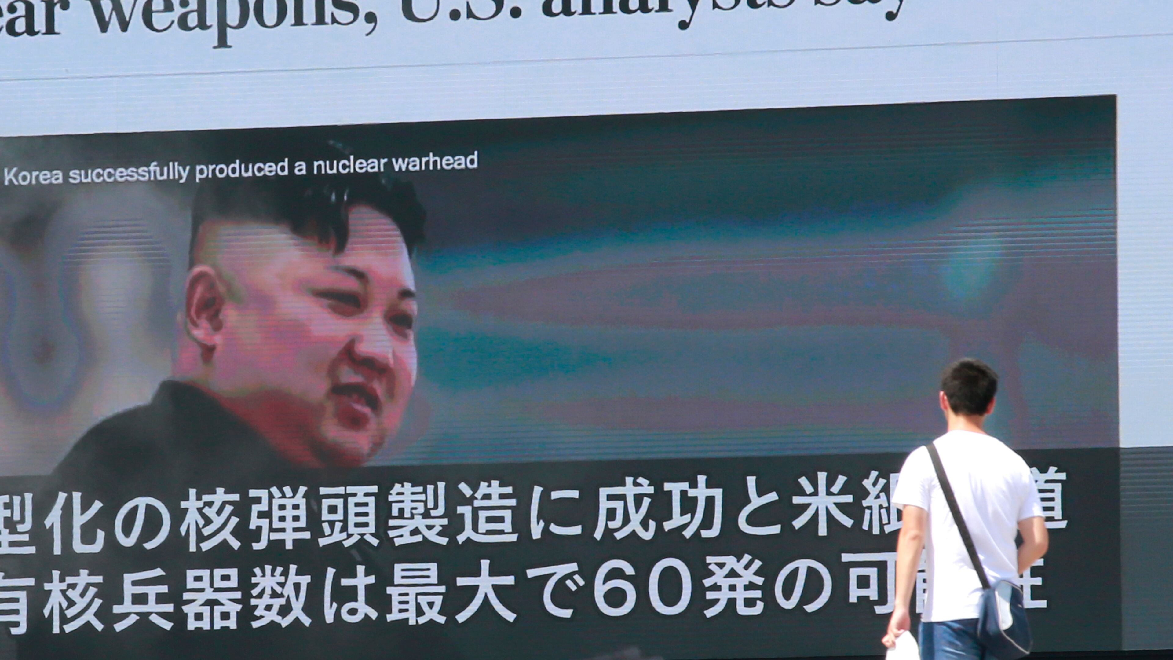 A man walks by a TV news program showing an image of North Korean leader Kim Jong Un in Tokyo on Wednesday. AP/Shizuo Kambayashi