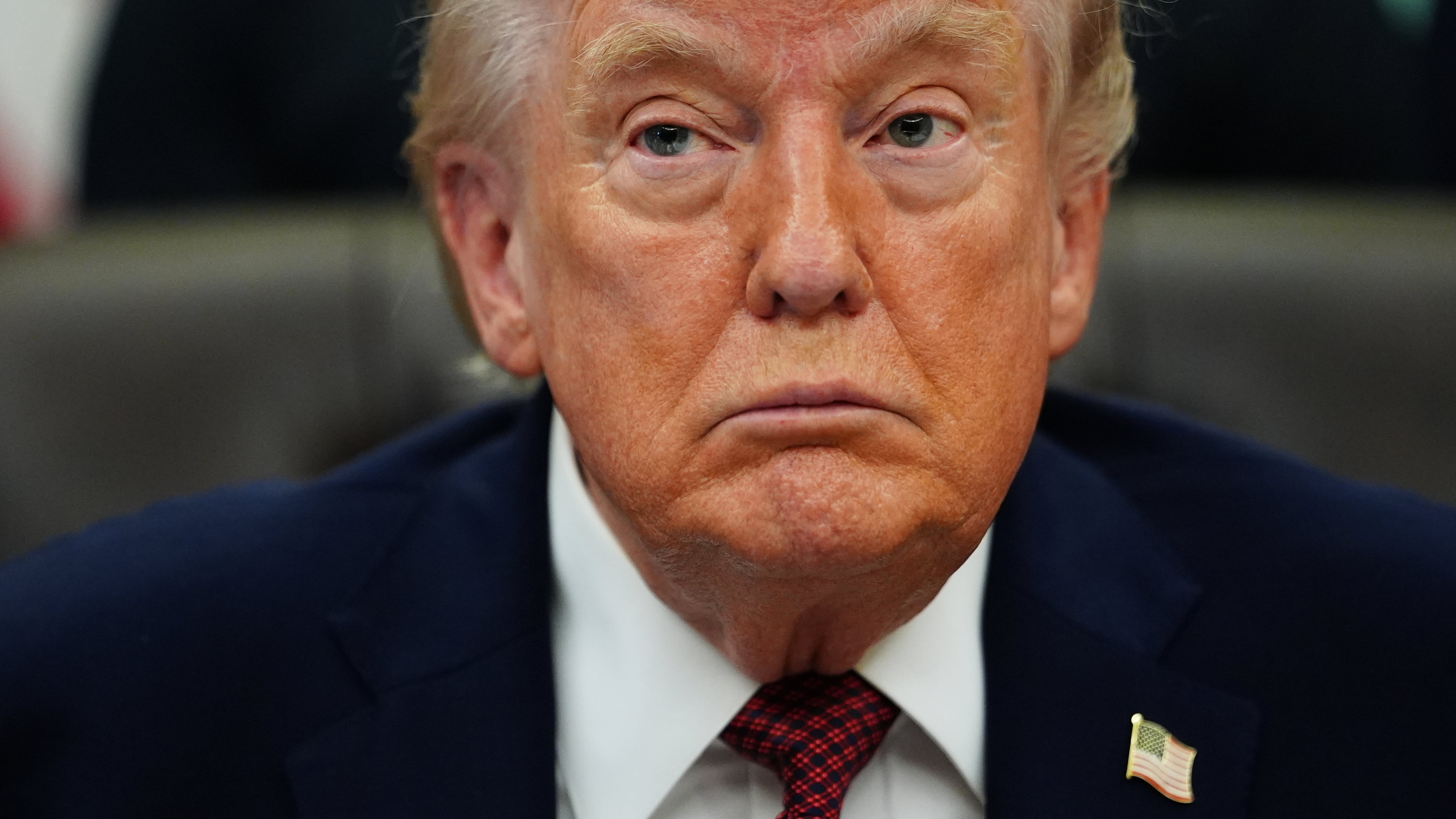 President Donald Trump listens to speeches before signing an executive order in the Oval Office of the White House, Saturday, April 18, 2026, in Washington. (AP Photo/Julia Demaree Nikhinson)