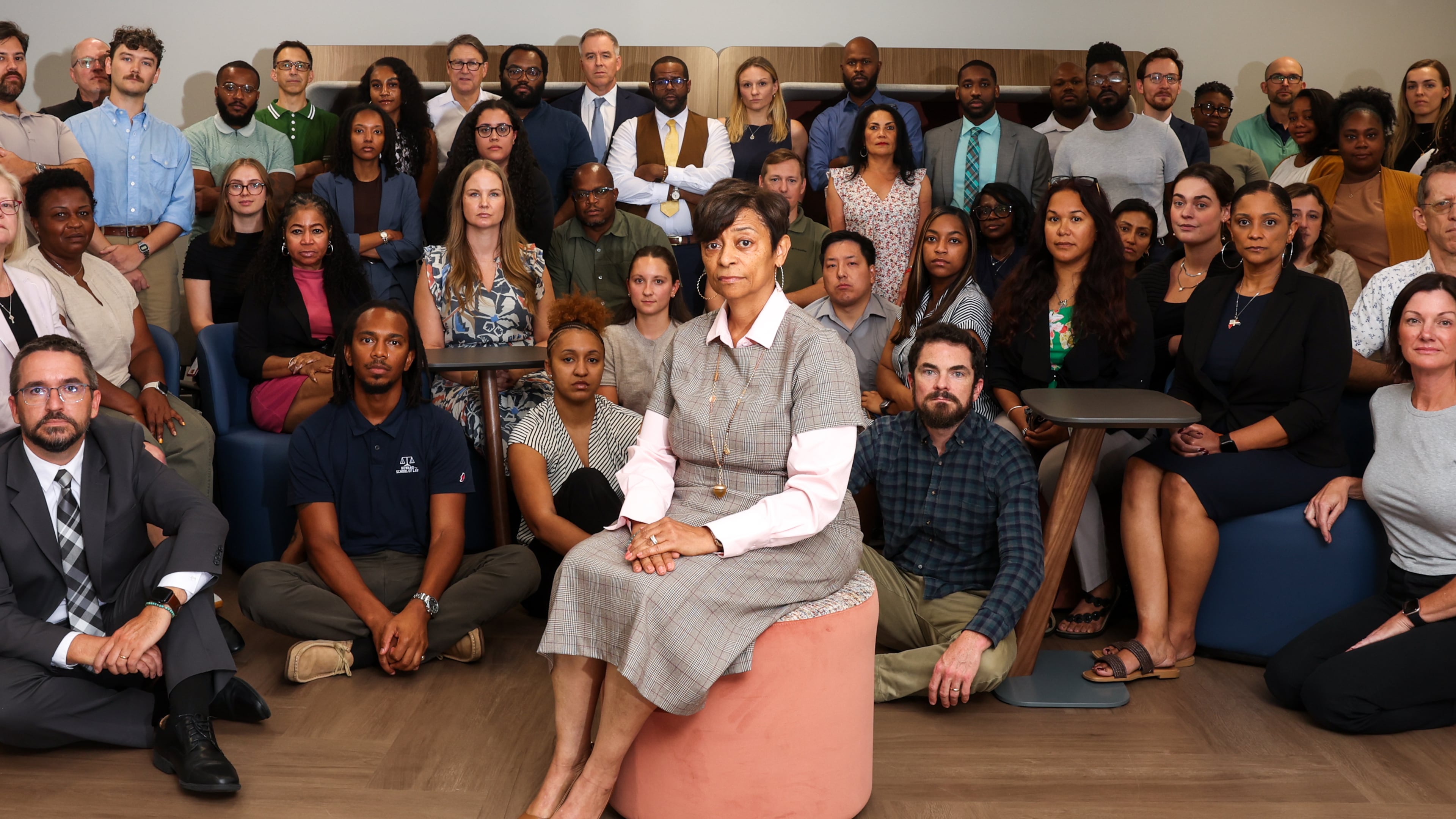 Natasha Perdew Silas, executive director of the Federal Defender Program, poses, at center, with her team at their office in Atlanta on Sept. 24, 2026. (Arvin Temkar/AJC)