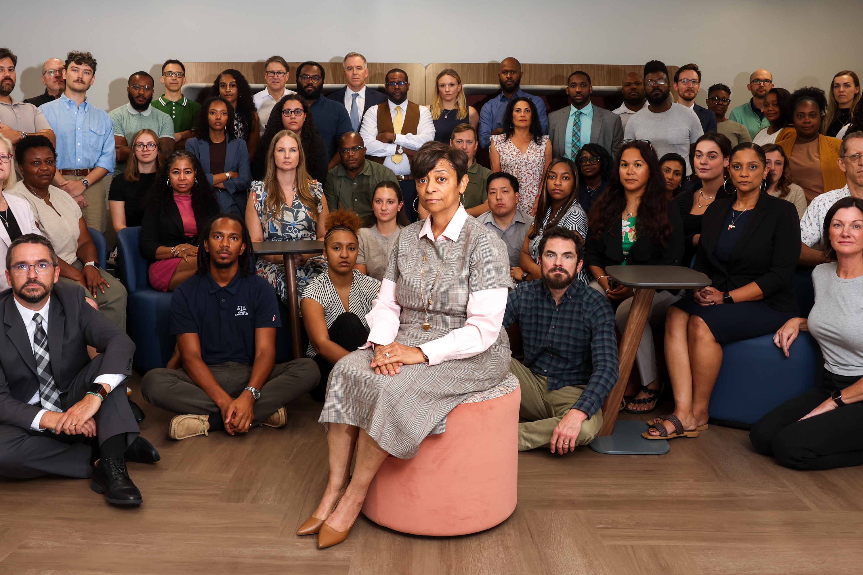 Natasha Perdew Silas, executive director of the Federal Defender Program, poses, at center, with her team at their office in Atlanta on Sept. 24, 2026. (Arvin Temkar/AJC)