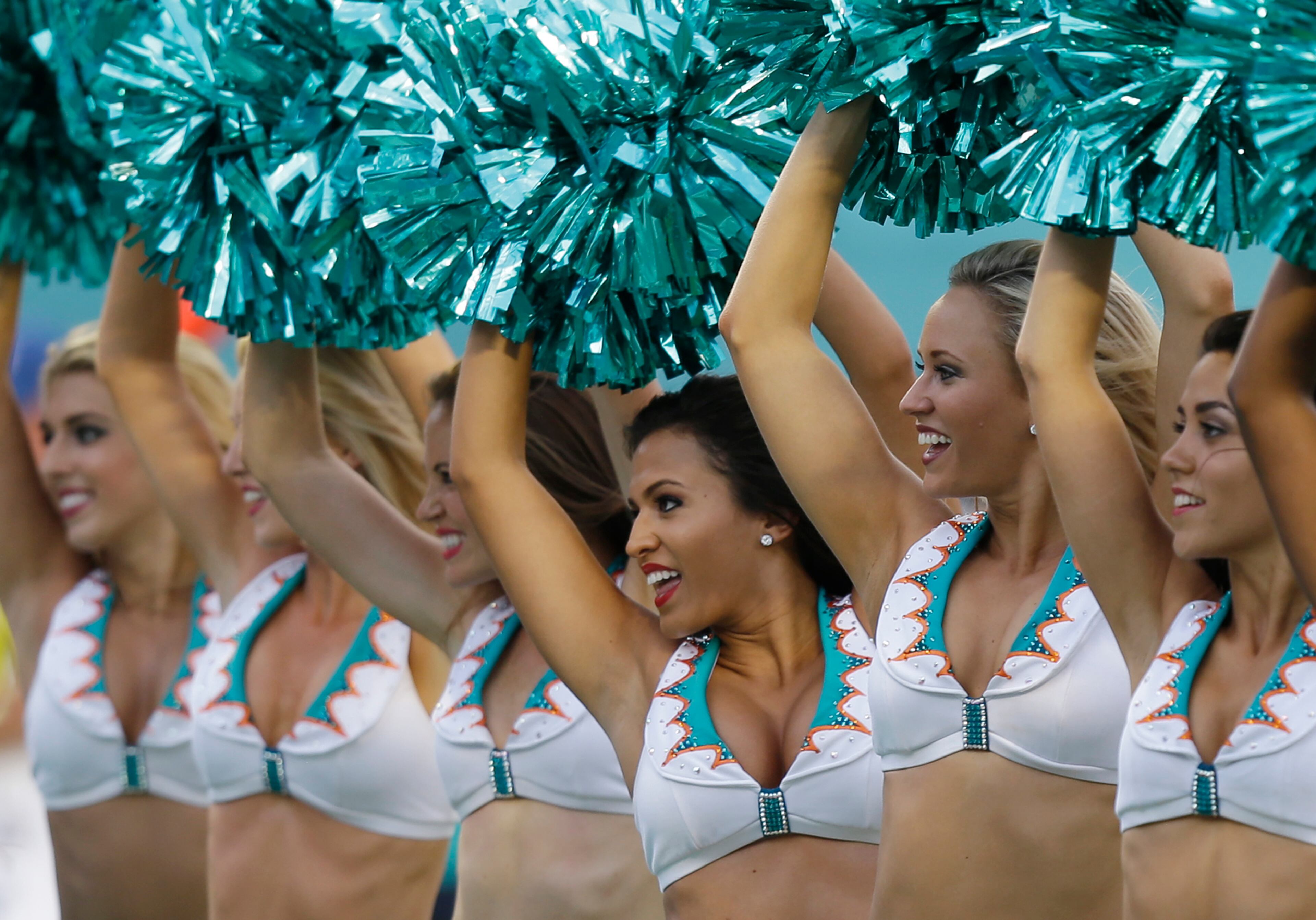 Miami Dolphins Cheerleaders perform during the second half of an NFL football game between the Miami Dolphins and the Kansas City Chiefs, Sunday, Sept. 21, 2014, in Miami Gardens, Fla. (AP Photo/Wilfredo Lee)