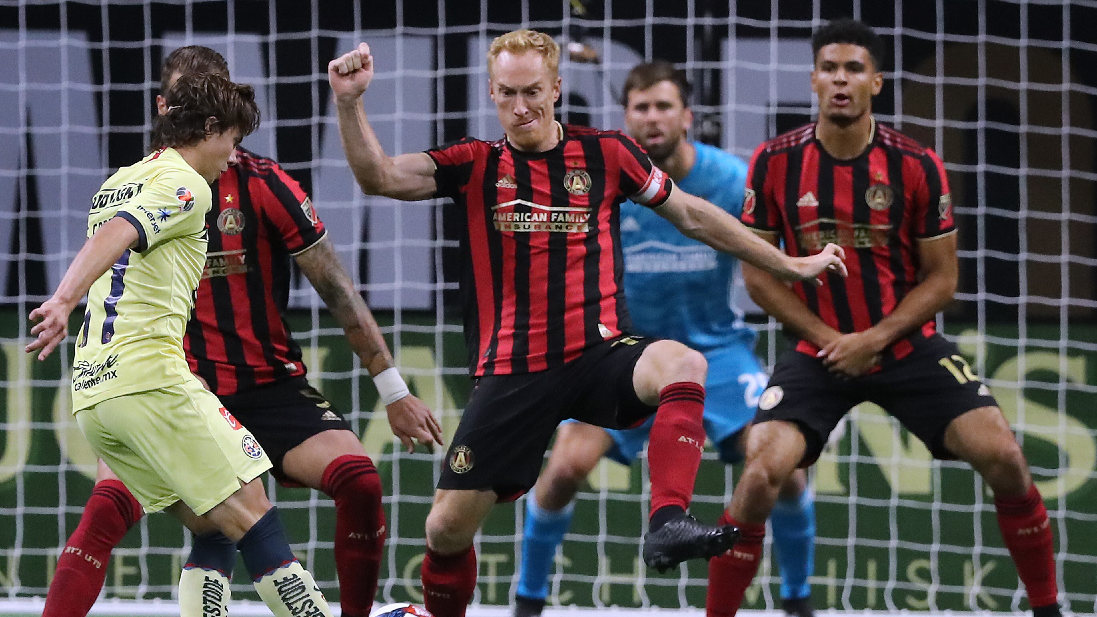 August 14, 2019 Atlanta: Atlanta United captain Jeff Larentowicz (center) and MIles Robinson (right) defend the goal against Club America midfielder Sebastian Cordova in the Campeones Cup on Wednesday, August 14, 2019, in Atlanta. Curtis Compton/ccompton@ajc.com