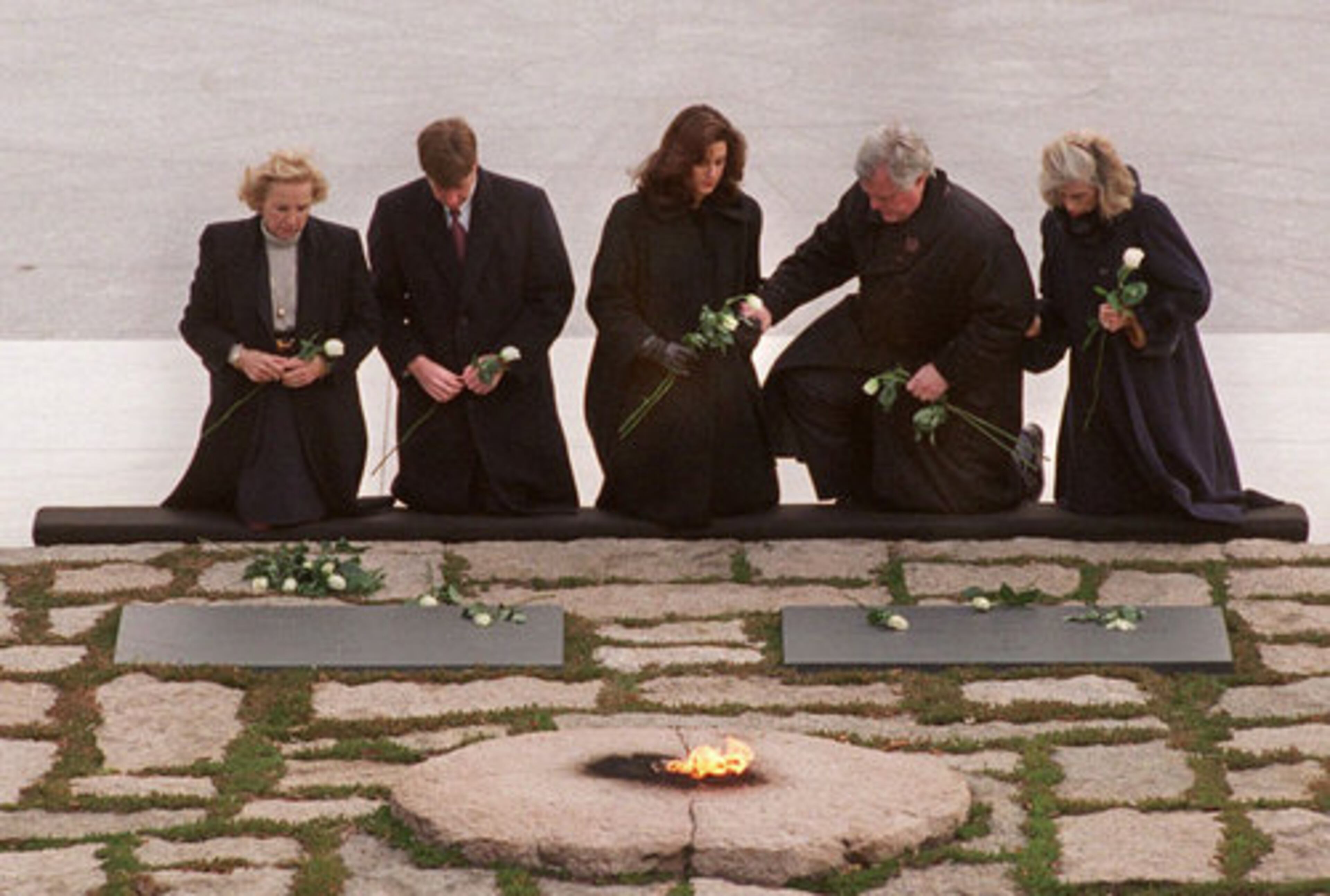 With the Eternal Flame burning in the foreground, members of the Kennedy family gather at the gravesites of President John Kennedy and wife Jacqueline in 1995, at Arlington National Cemetery in Arlington, Va. From left are Ethel Kennedy, wife of the late Robert Kennedy; Rep. Patrick Kennedy, (D-R.I.); Victoria Reggie, wife of Sen. Edward Kennedy (D-Mass.), Sen. Kennedy, and Eunice Shriver.