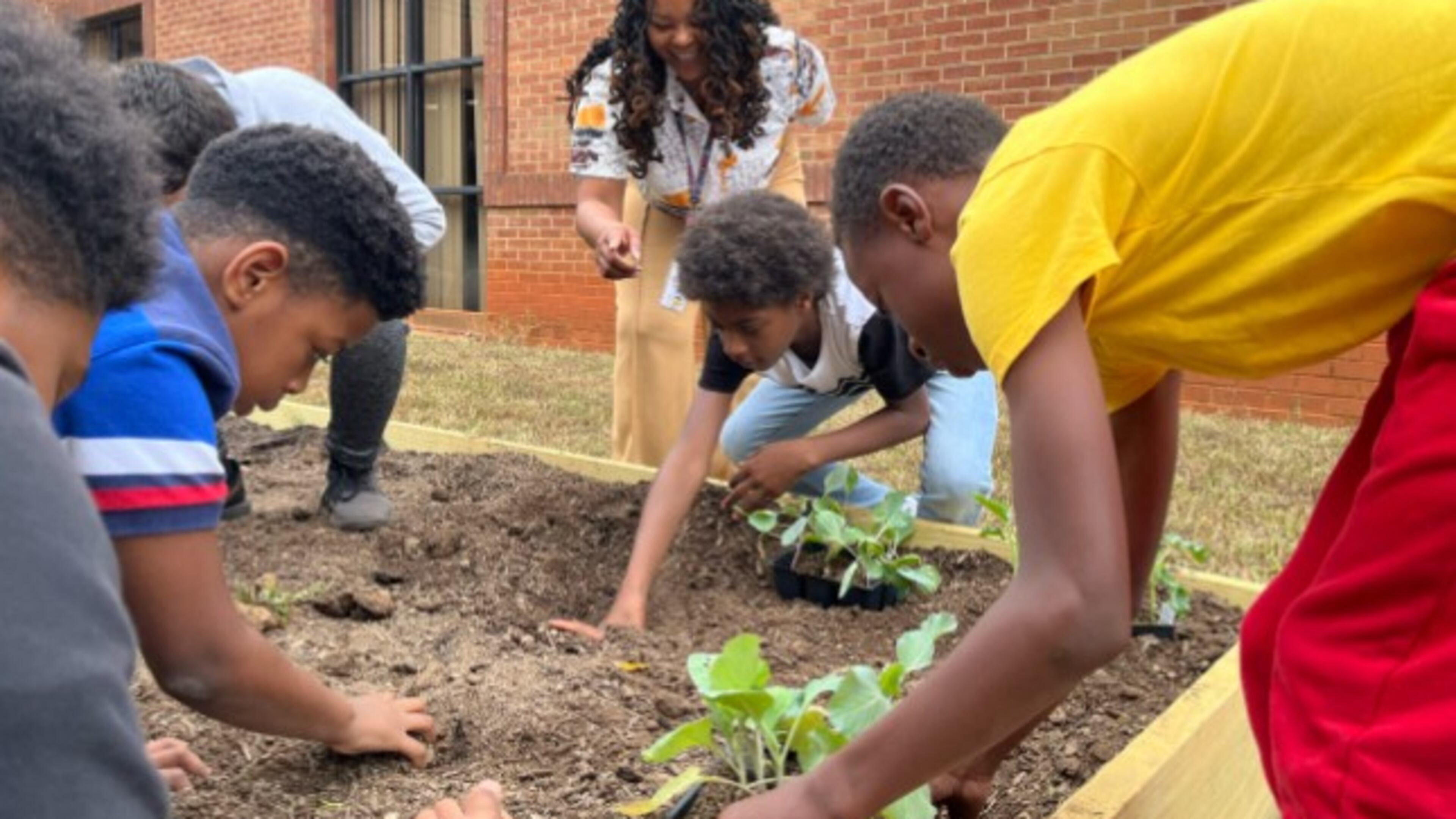 Oakland Elementary students participate in an initiative to plant and grow vegetables at their school’s community garden. (Courtesy of Henry County Schools)