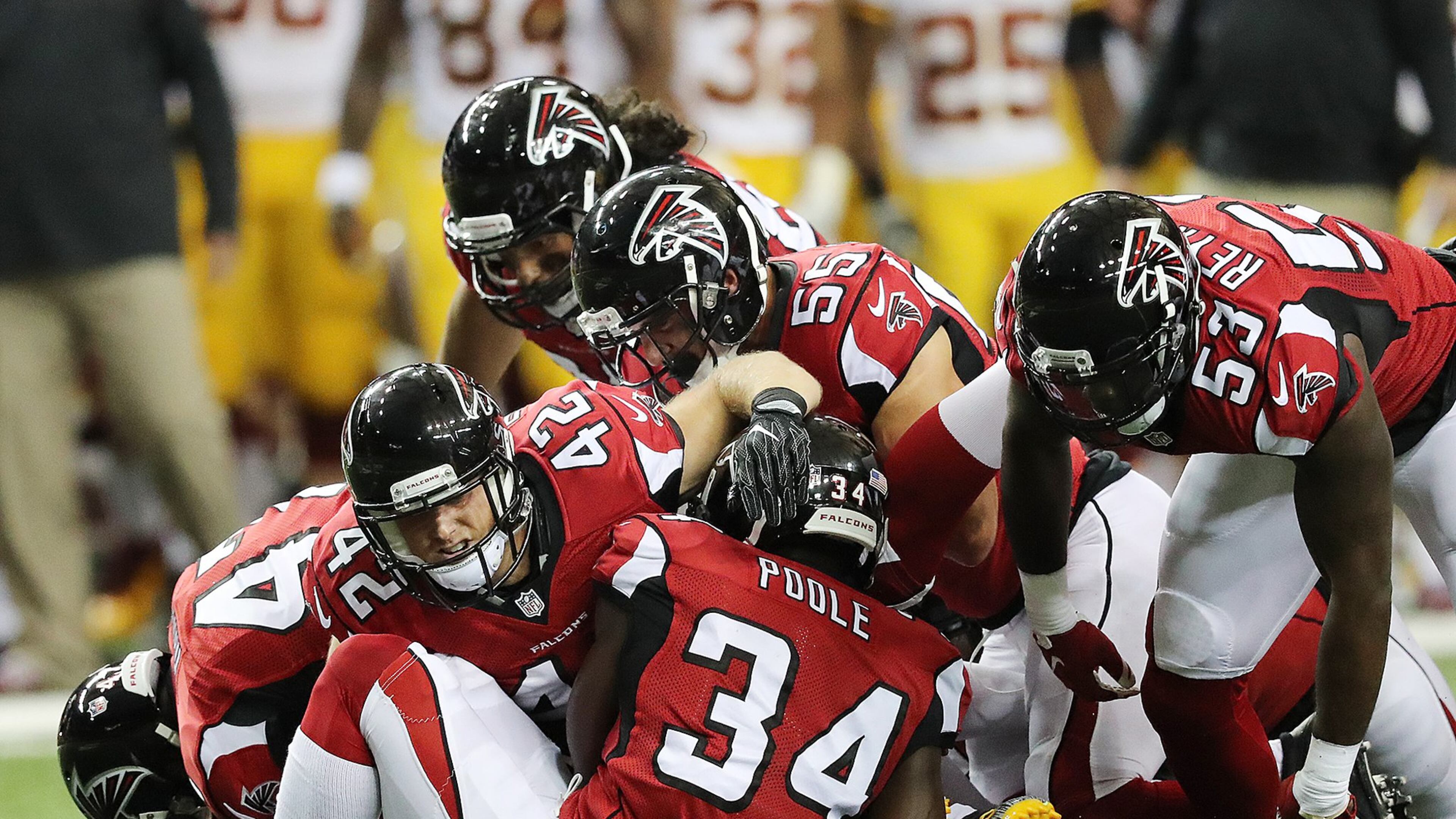 081116 ATLANTA: Falcons defenders swarm Redskins safety Will Blackmon on a punt during the first quarter in an NFL preseason football game on Thursday, August 11, 2016, in Atlanta. Curtis Compton /ccompton@ajc.com